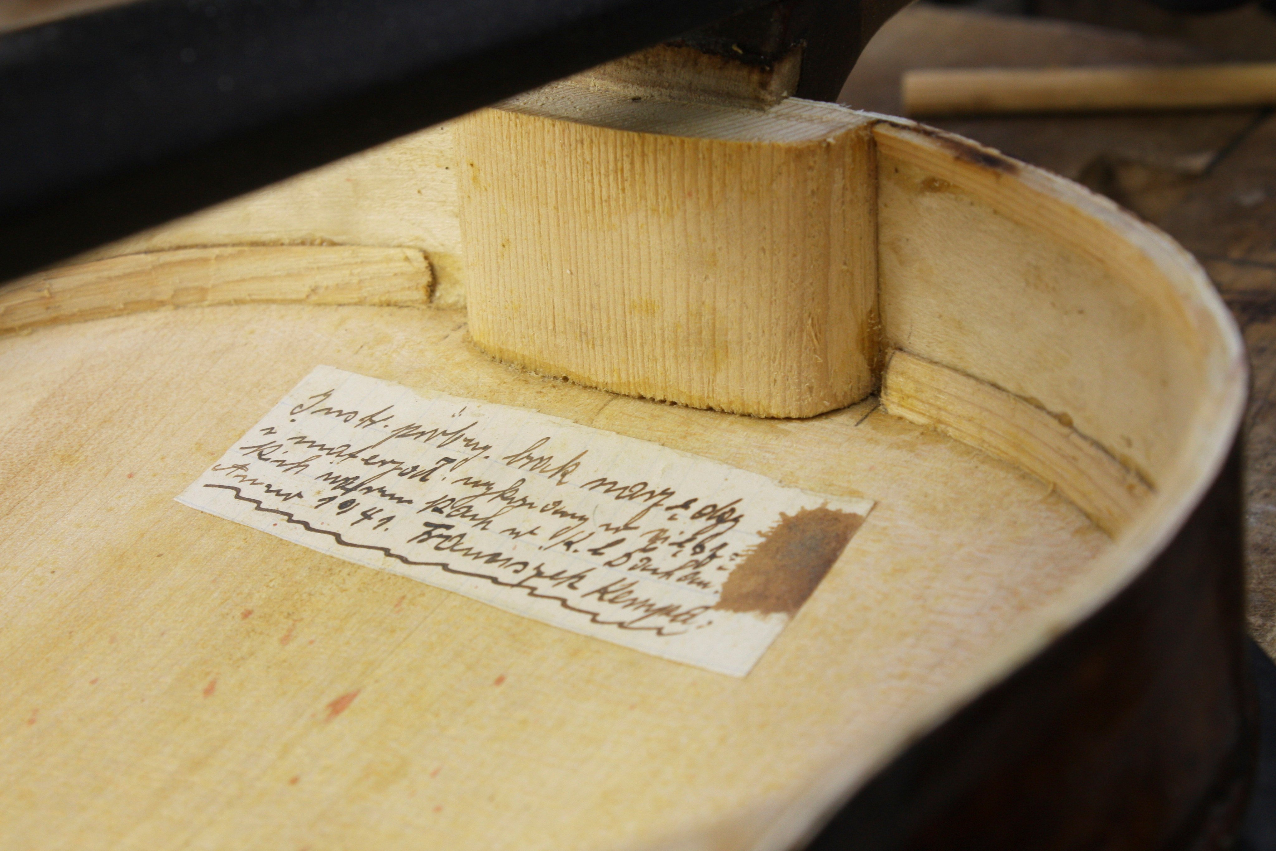 A hidden handwritten message in the Silesian dialect - a mix of Polish and German - is seen inside an instrument dubbed the ‘’violin of hope’’ made by Franciszek “Franz” Kempa at the Dachau concentration camp near Munich, Germany, in 1941. Photo: AP