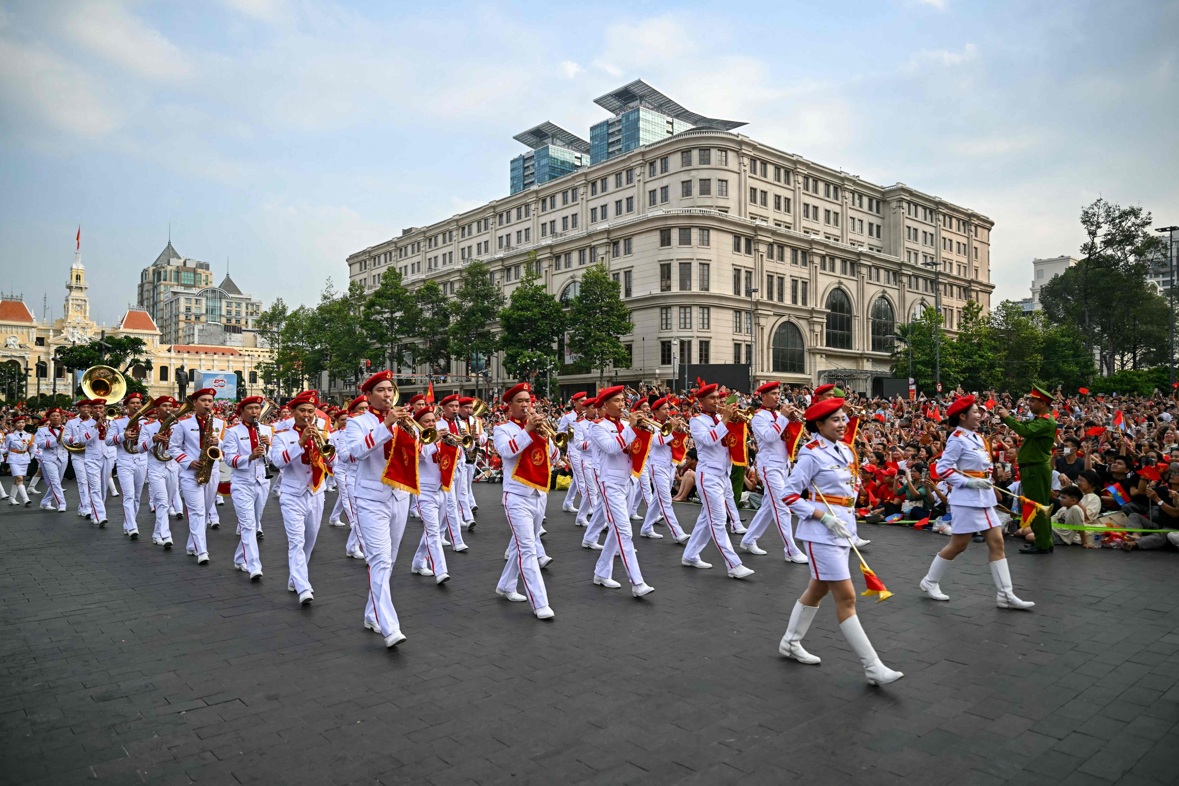 A marching band takes part in a parade in Ho Chi Minh City on Wednesday marking the 50th anniversary of the fall of Saigon and the end of the Vietnam war. Photo: AFP