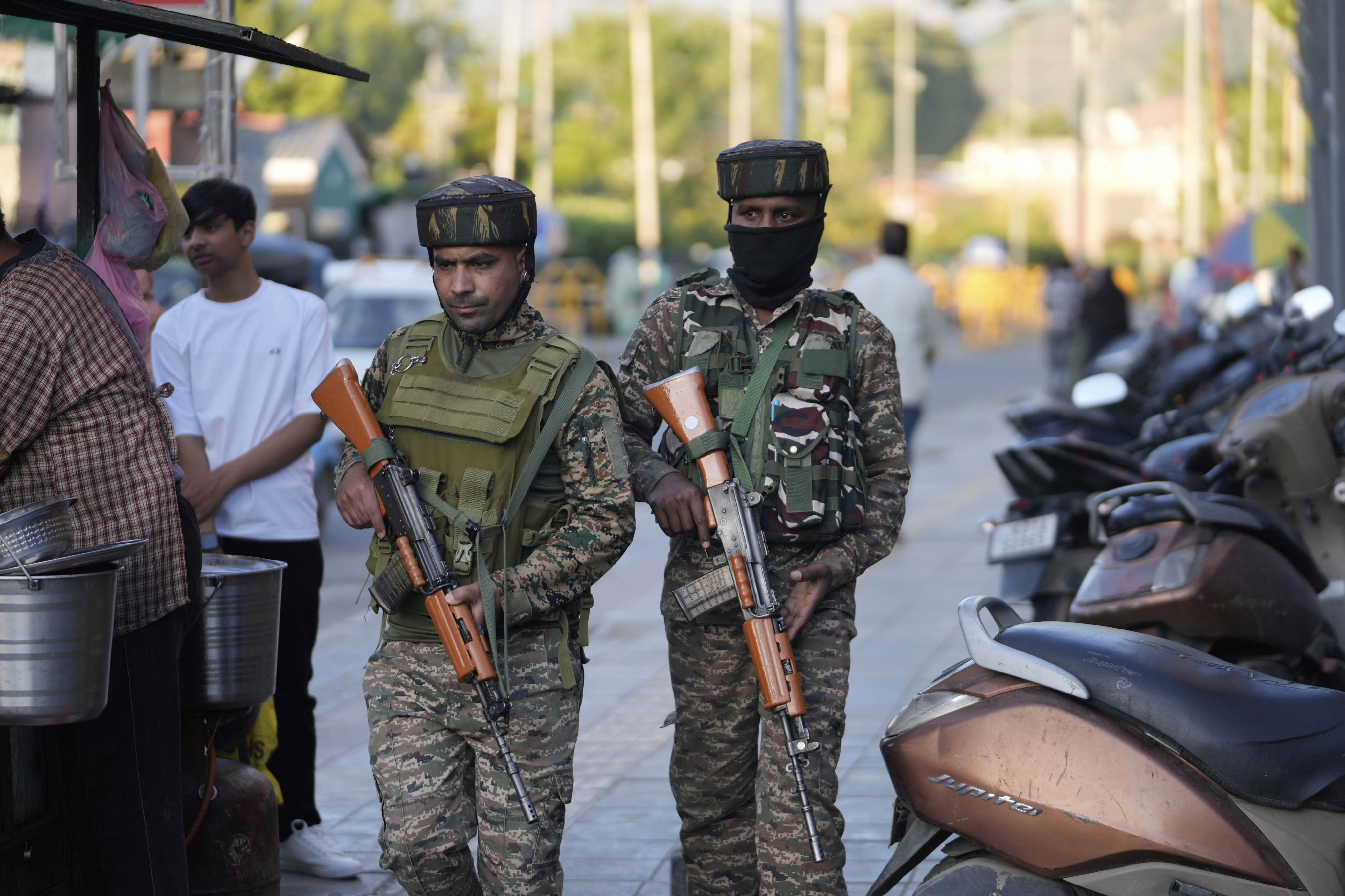 Indian paramilitary soldiers patrol a busy market in Srinagar in Indian-controlled Kashmir on Tuesday. Photo: AP