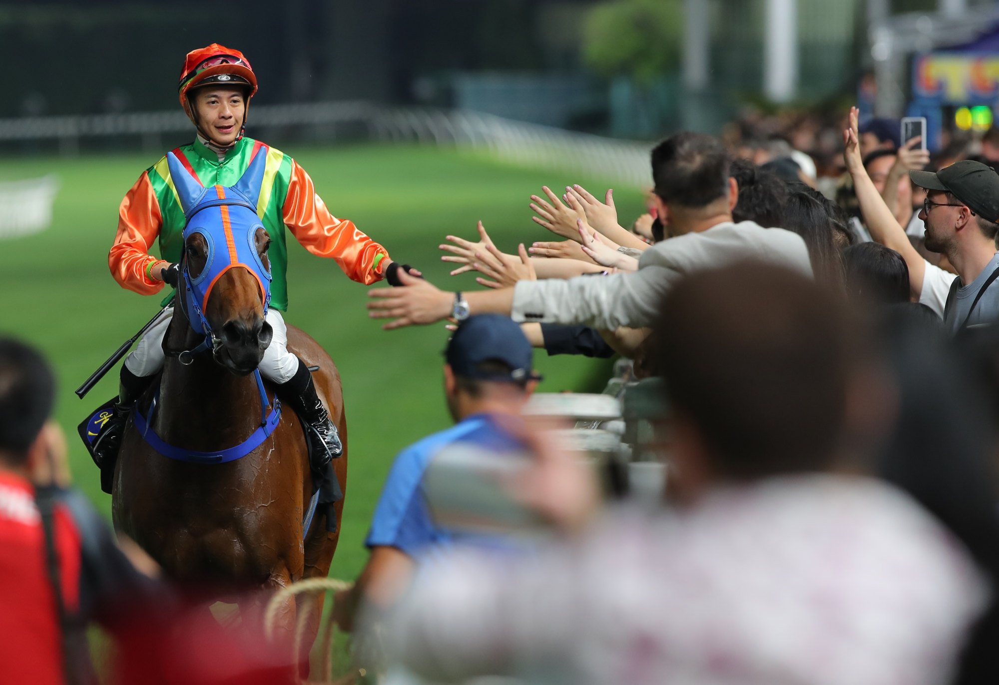 Derek Leung takes the acclaim of the crowd as he heads back in on Glory Elite.