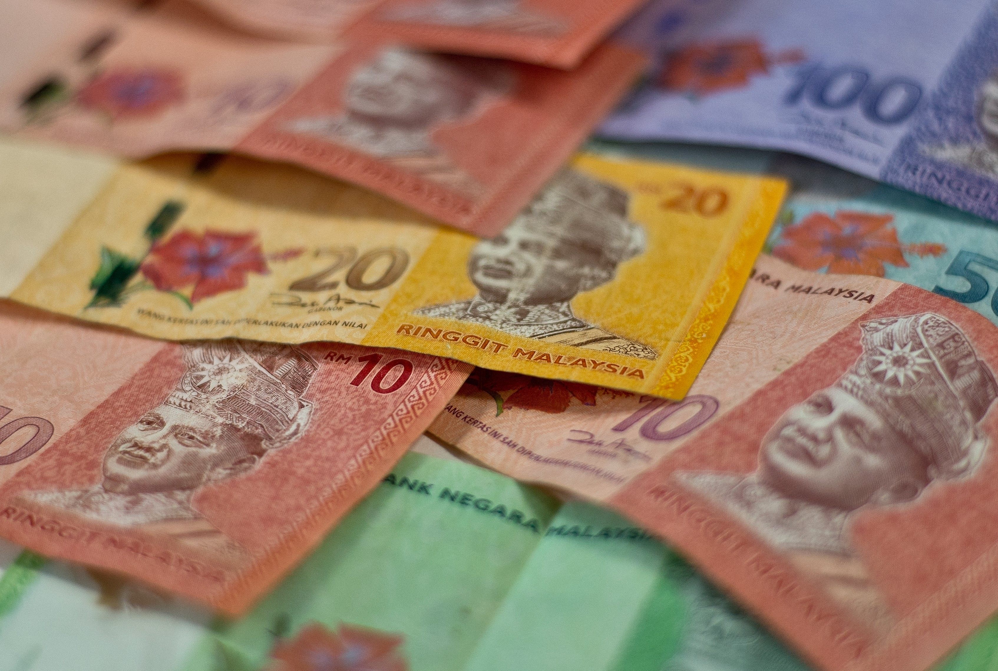 A woman said she borrowed money from relatives and friends to settle her son’s 30,000 ringgit debt. Photo: AFP