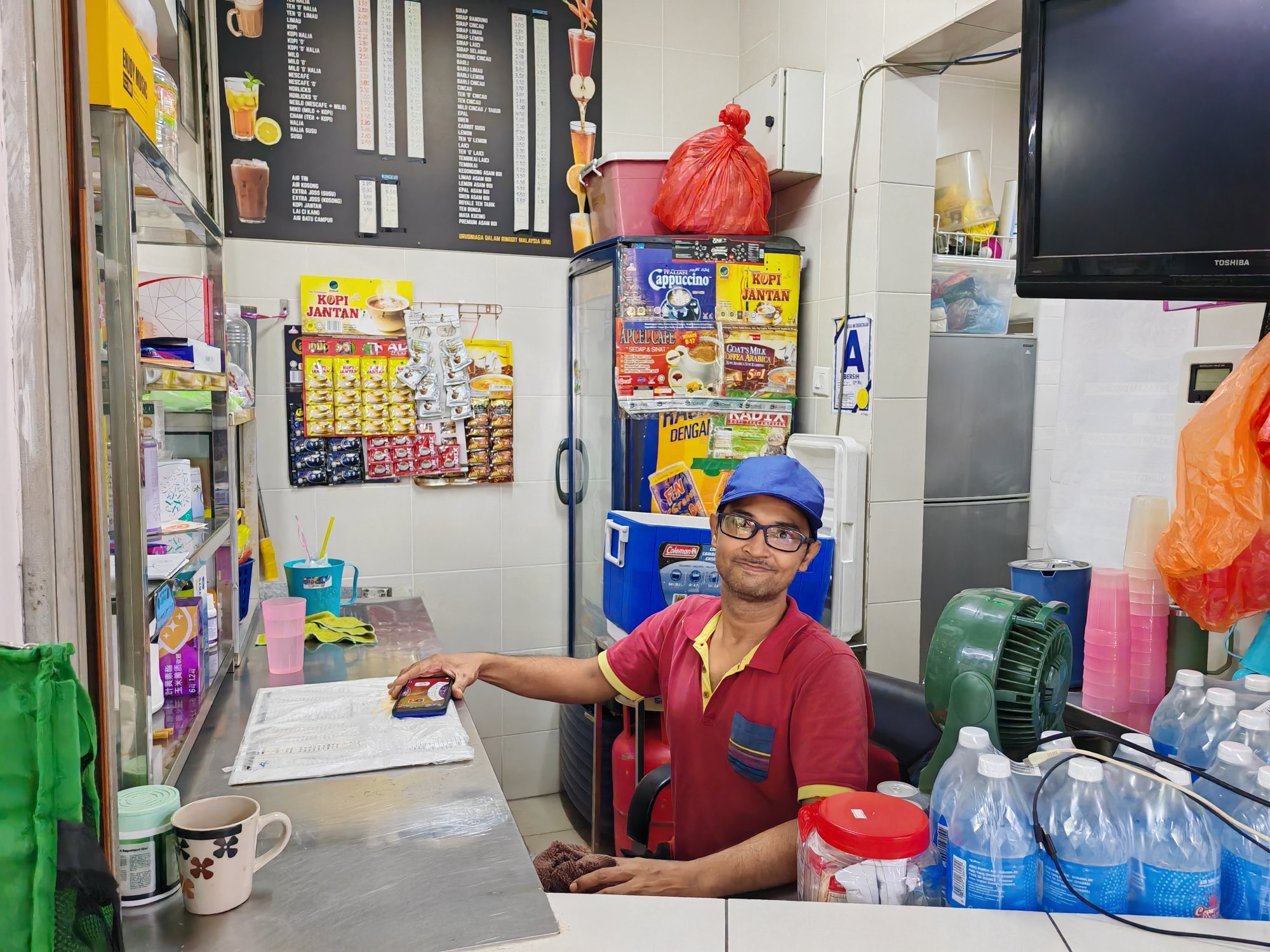 Drinks seller Zaki Che Zubir, 40, says he has had to raise prices “many times” to keep pace with rising costs of raw materials. Photo: Joseph Sipalan Drinks seller Zaki Che Zubir, 40, says he has had to raise prices “many times” to keep pace with rising costs of raw materials. Photo: Joseph Sipalan