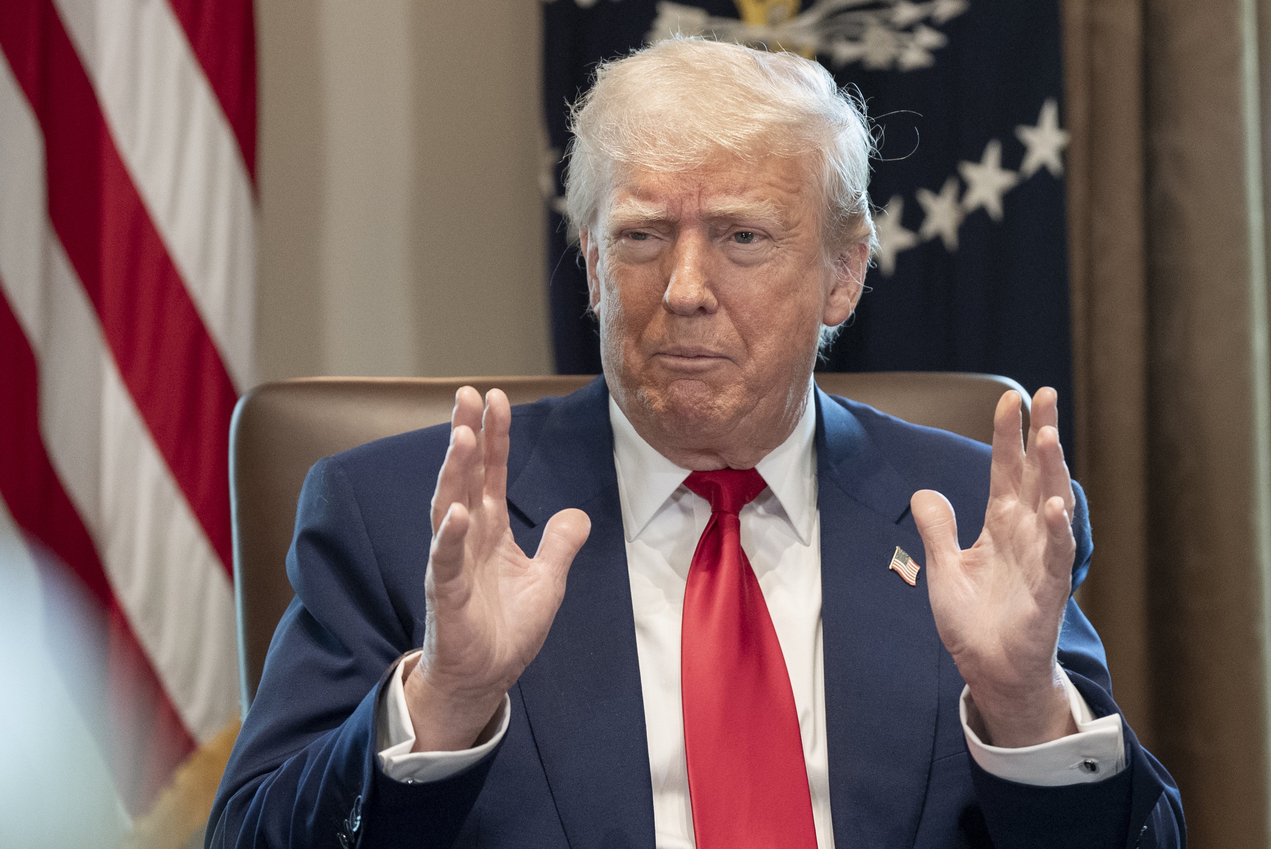 US President Donald Trump listens to remarks during a cabinet meeting in the White House on Wednesday. Photo: EPA-EFE