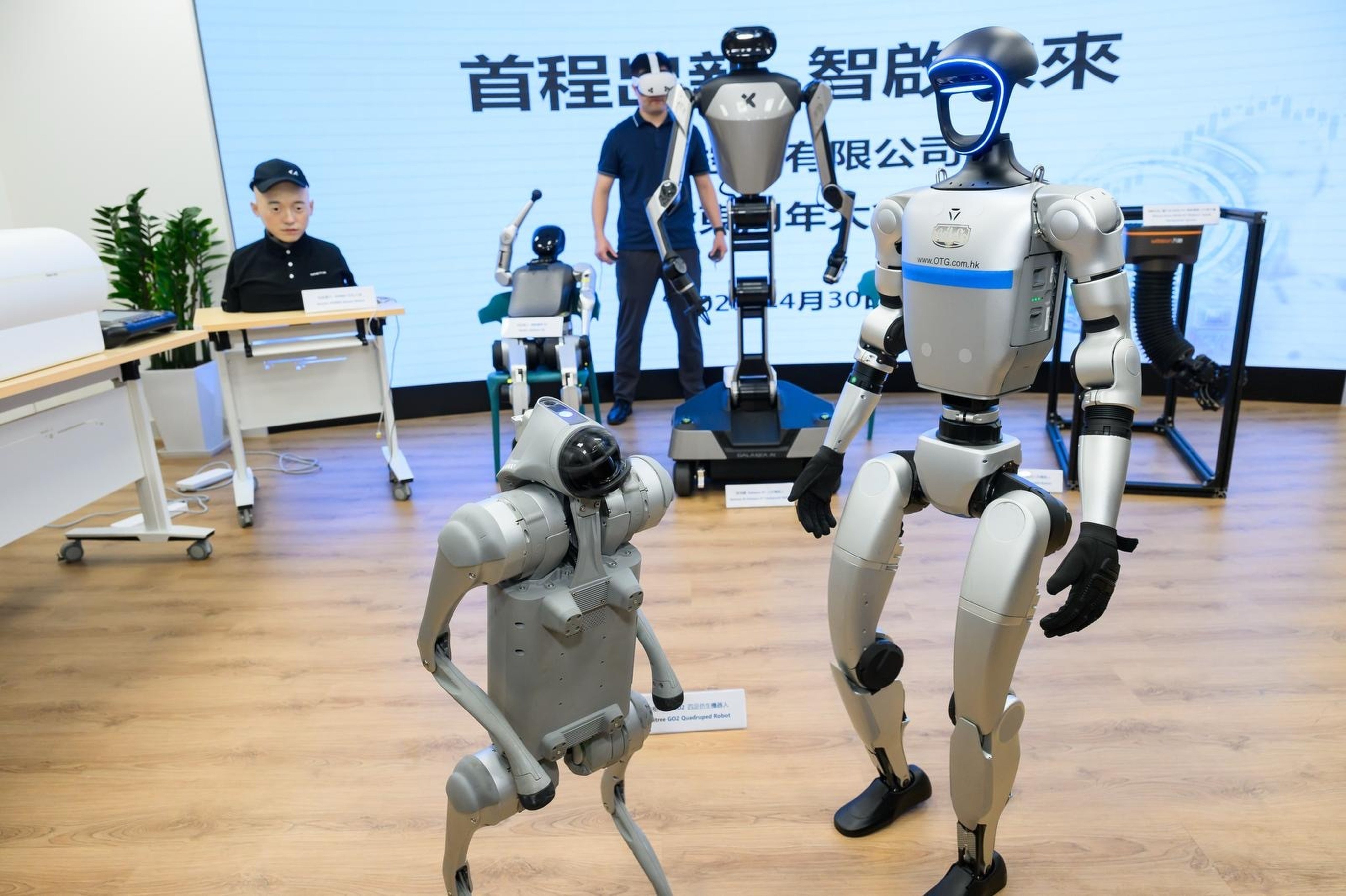 Shoucheng Holdings presents humanoid robots from some of its investee firms, including Unitree Robotics and Galaxea AI, at an event in Hong Kong on April 30, 2025. Photo: Handout