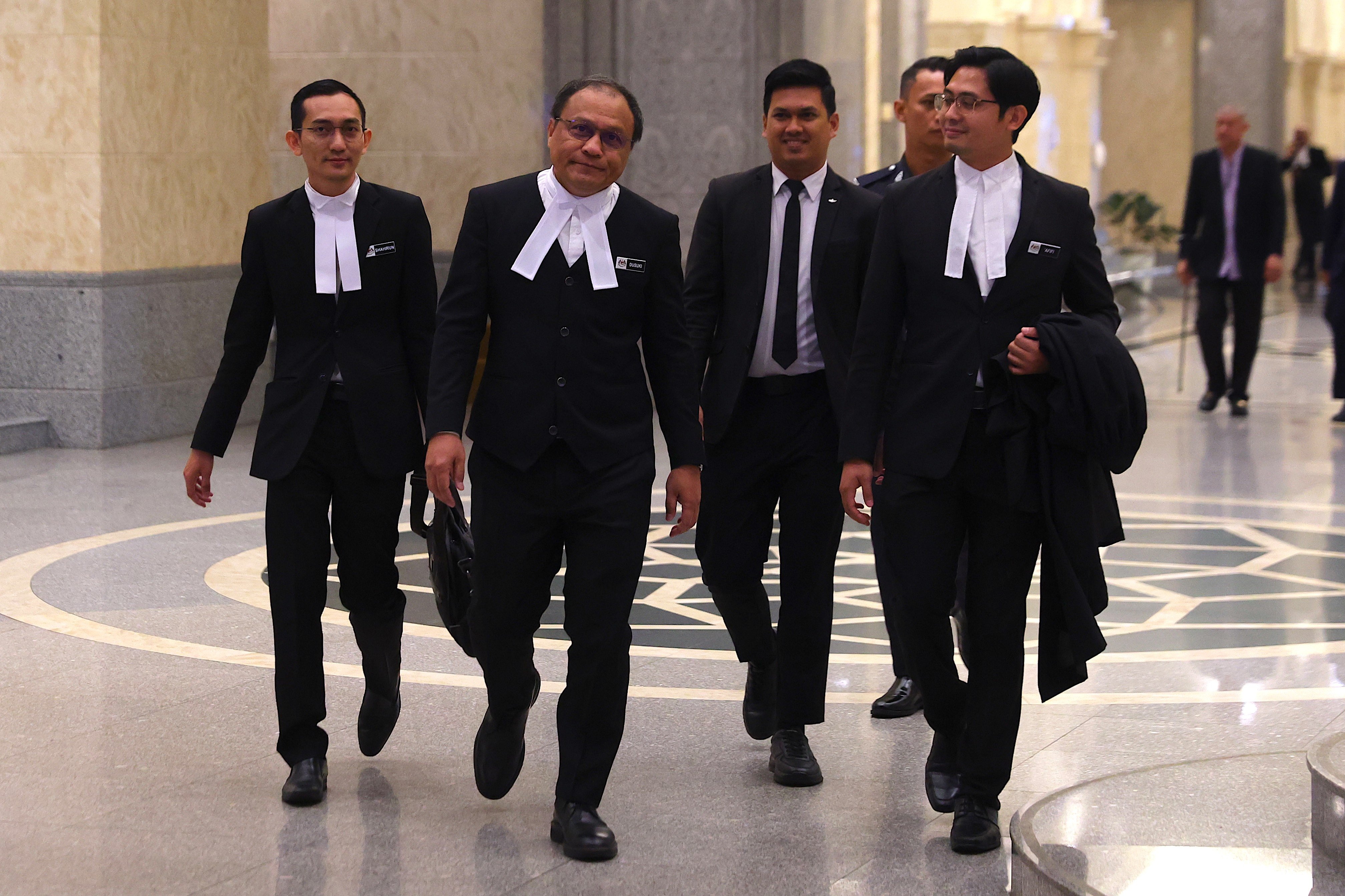 Malaysia attorney-general Mohd Dusuki Mokhtar (second left) and his team arrives to appeal against a royal addendum for jailed former prime minister Najib Razak at the Federal Court in Putrajaya, Malaysia on Monday. Photo: EPA-EFE