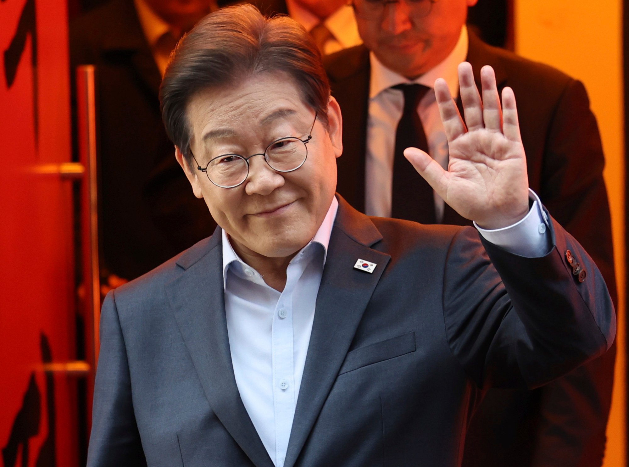South Korea’s Democratic Party presidential candidate Lee Jae-myung exits a meeting with delivery workers in Seoul, South Korea on Thursday. Photo: Yonhap/AP South Korea’s Democratic Party presidential candidate Lee Jae-myung exits a meeting with delivery workers in Seoul, South Korea on Thursday. Photo: Yonhap/AP