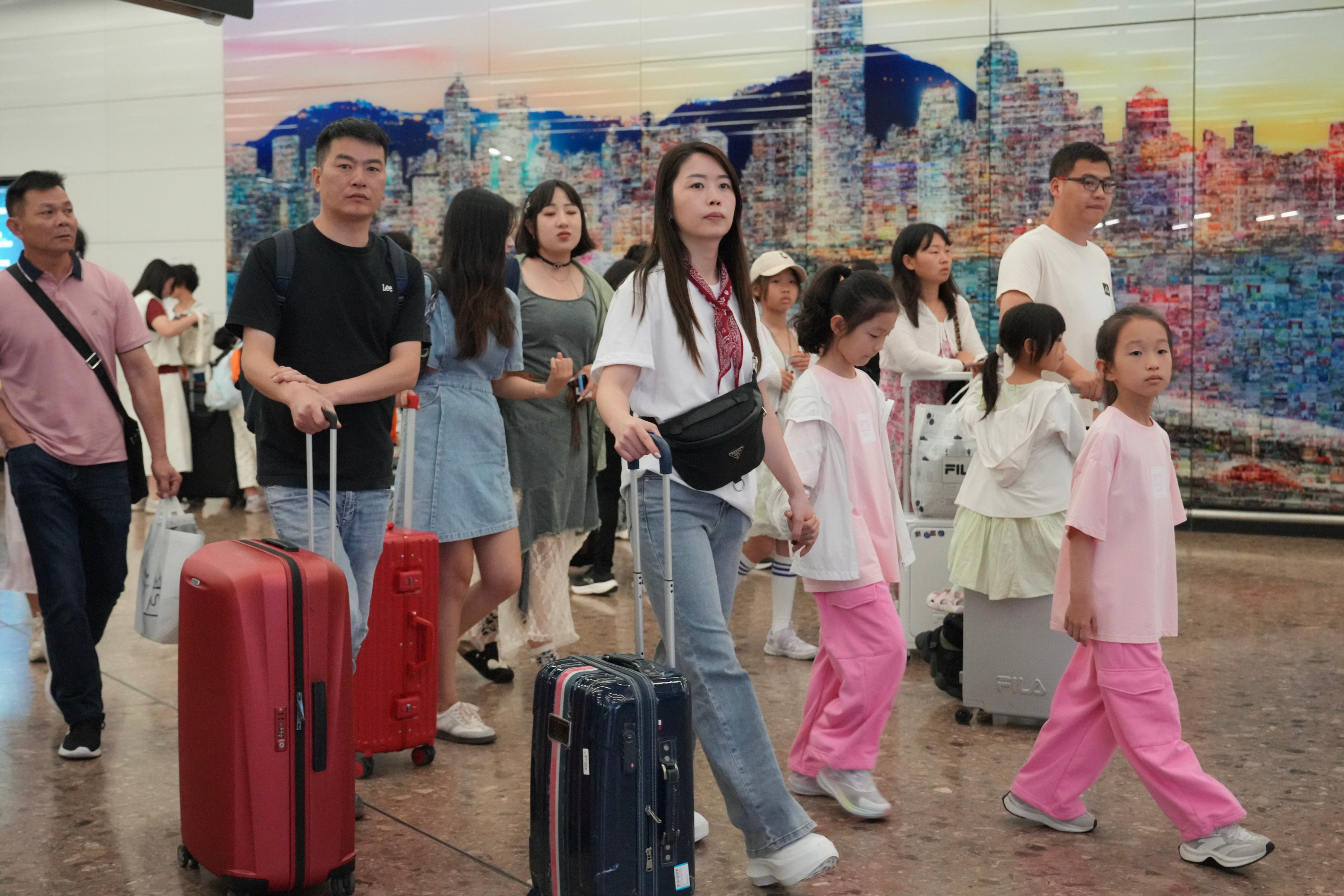 Tourists arrive at the West Kowloon high-speed rail terminus at the start of the “golden week” holiday. Photo: May Tse