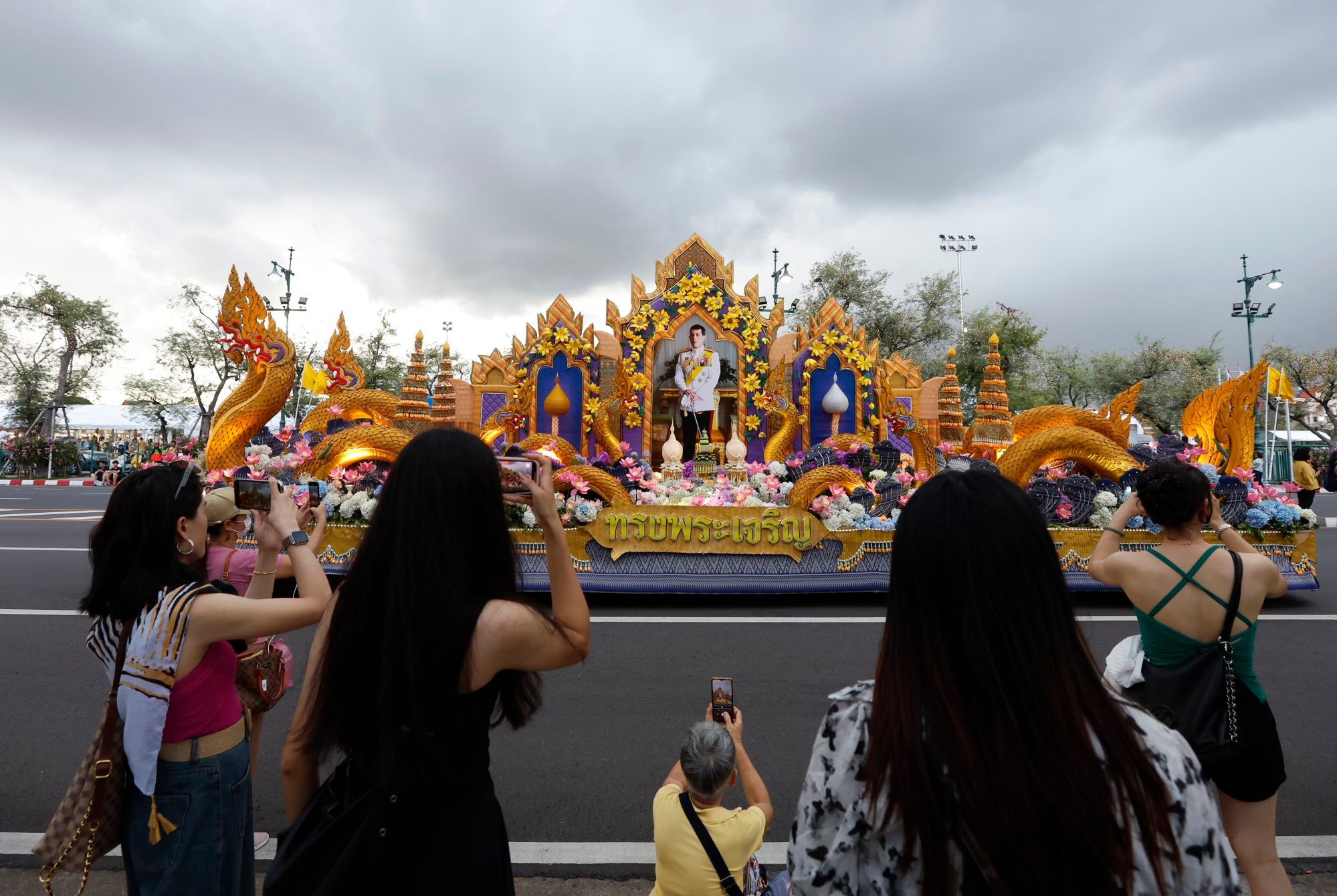 Tourists take photos of the procession in honour of Thai King Maha Vajiralongkorn’s 72nd birthday in Bangkok in 2024. Criticism of the king and his close family and carries sentences of up to 15 years in jail. Photo: EPA-EFE Tourists take photos of the procession in honour of Thai King Maha Vajiralongkorn’s 72nd birthday in Bangkok in 2024. Criticism of the king and his close family and carries sentences of up to 15 years in jail. Photo: EPA-EFE