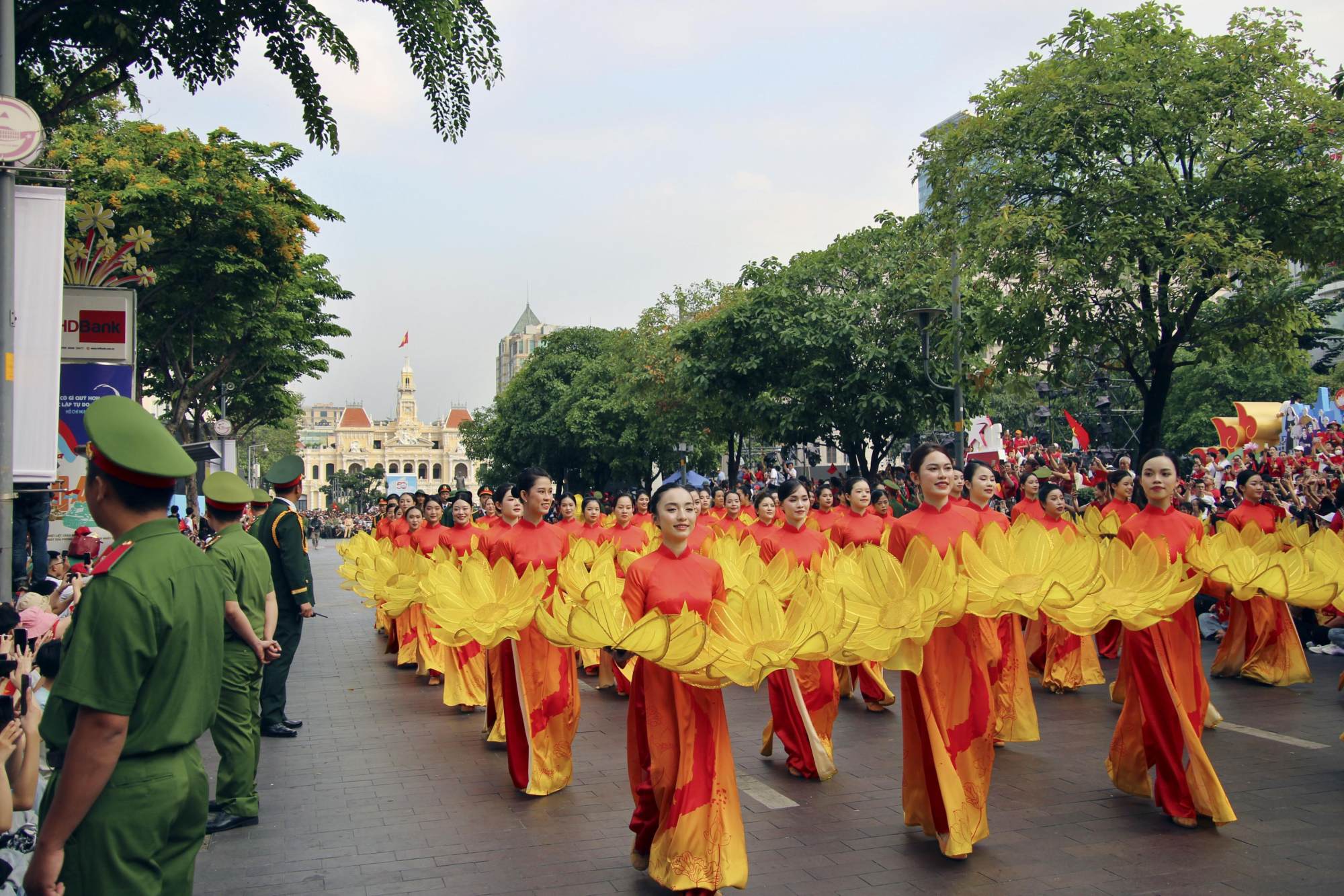 Revellers watch a parade marking the 50th anniversary of reunification in Ho Chi Minh City on Wednesday. Photo: Kyodo Revellers watch a parade marking the 50th anniversary of reunification in Ho Chi Minh City on Wednesday. Photo: Kyodo