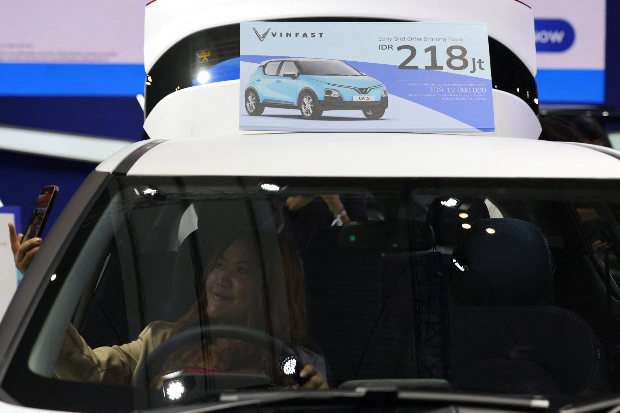 A visitor takes a selfie inside a Vinfast car at the Indonesia International Auto Show in Tangerang last year. Photo: Reuters A visitor takes a selfie inside a Vinfast car at the Indonesia International Auto Show in Tangerang last year. Photo: Reuters