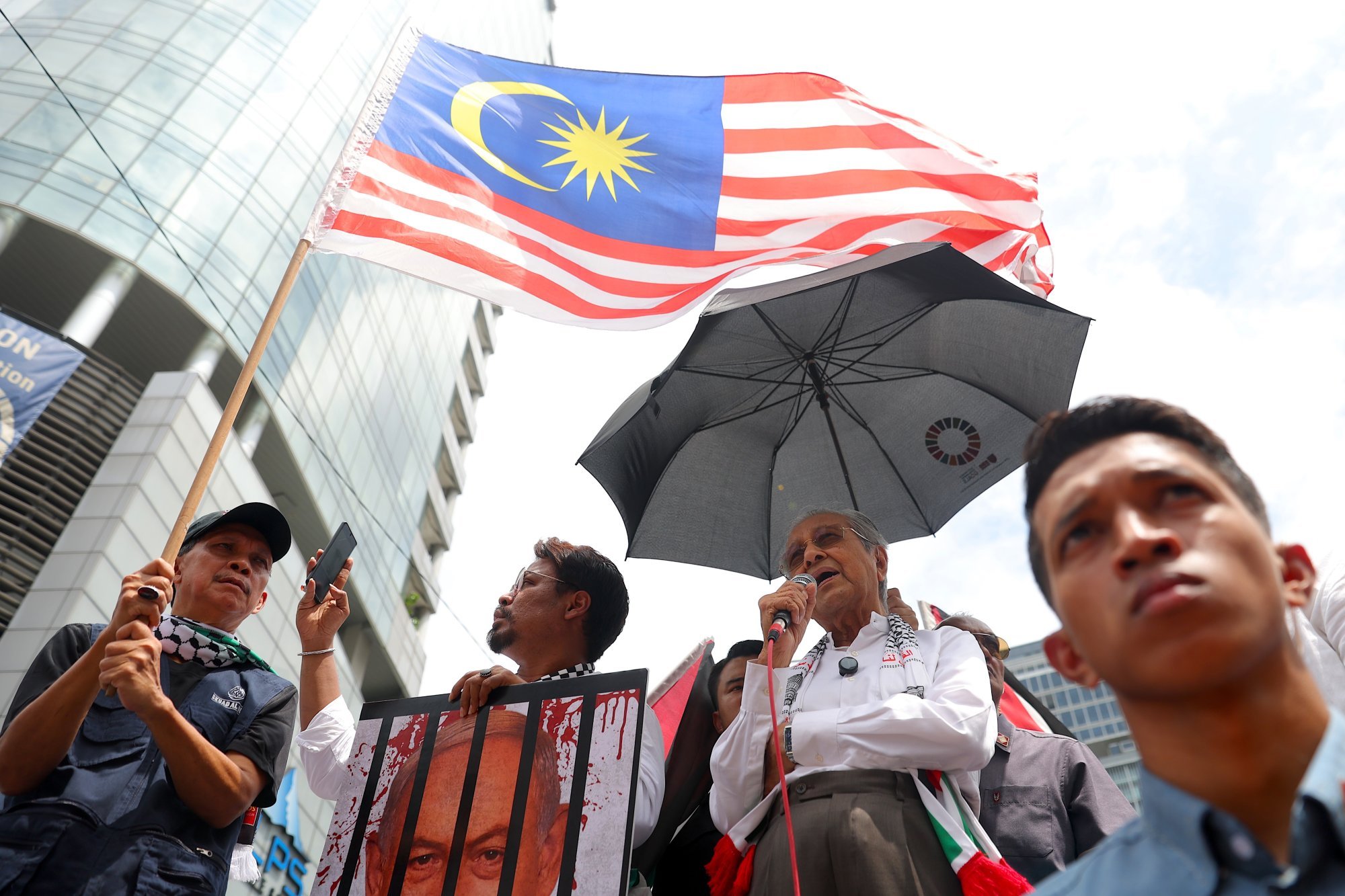 Mahathir speaks during a rally in solidarity with the Palestinian people, near the US embassy in Kuala Lumpur, on March 28. Photo: EPA-EFE Mahathir speaks during a rally in solidarity with the Palestinian people, near the US embassy in Kuala Lumpur, on March 28. Photo: EPA-EFE