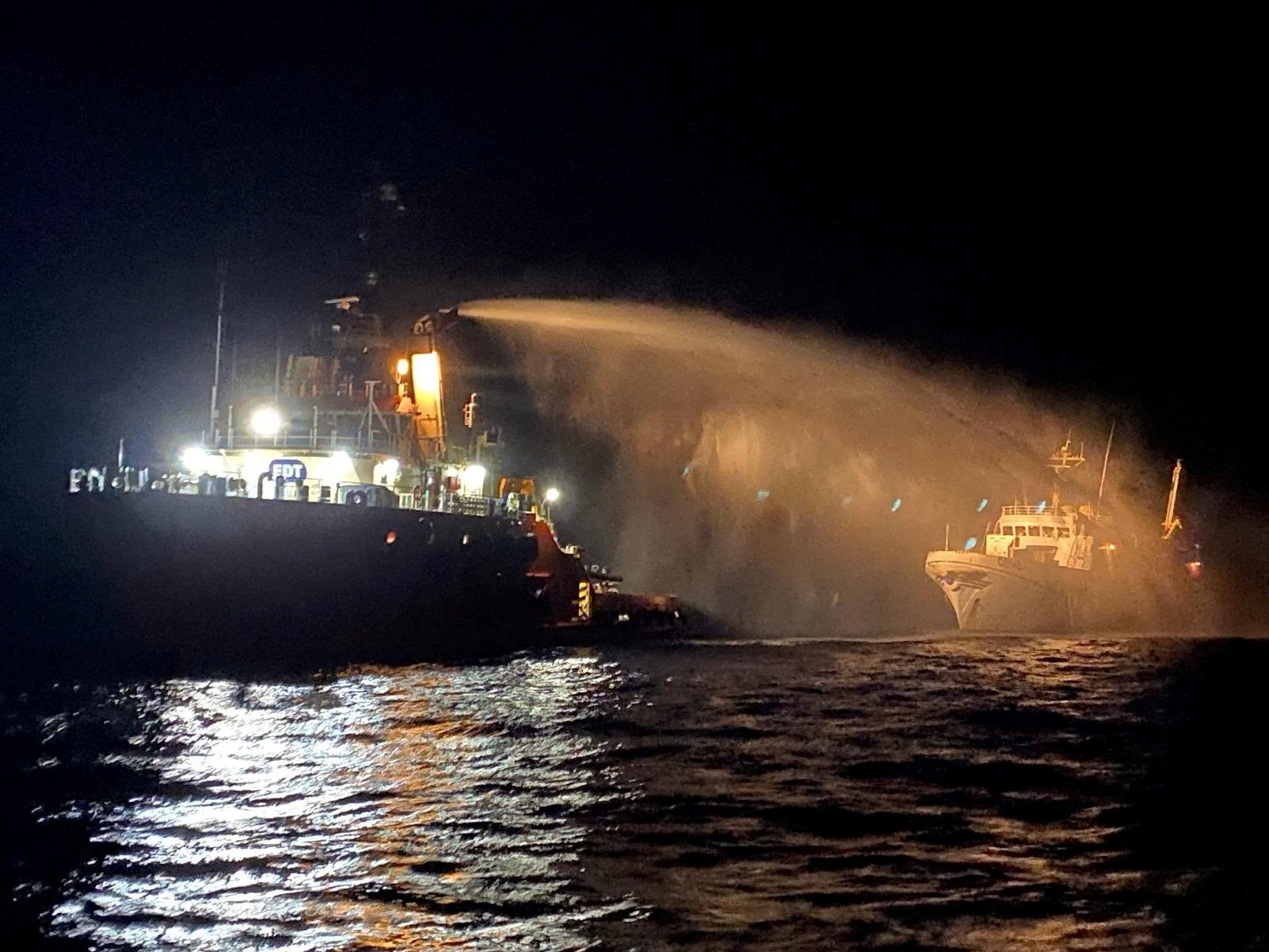 A tug vessel puts out a fire on the Gaza Freedom Flotilla vessel Conscience. Photo: Government of Malta via Reuters