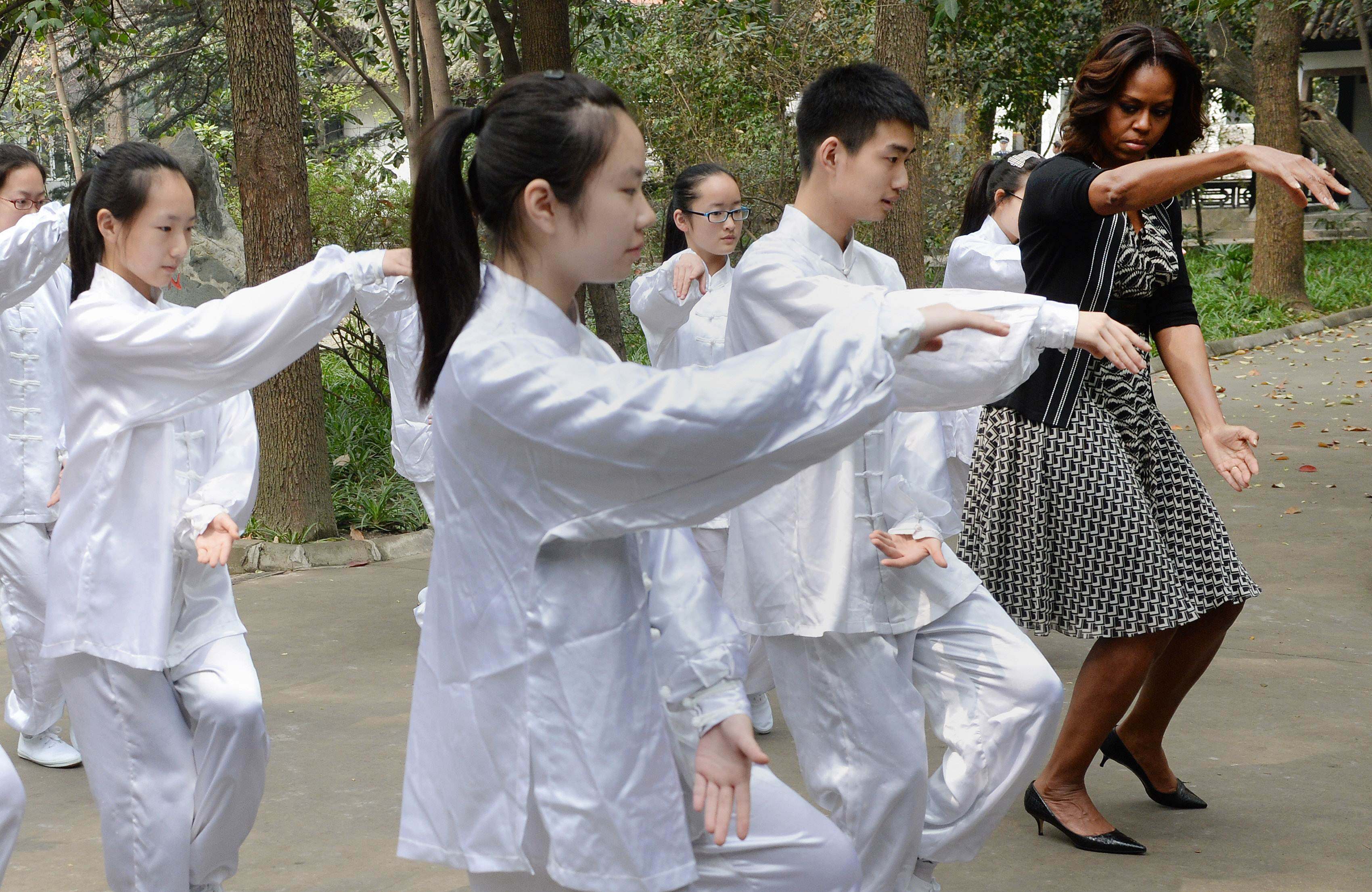 US first lady Michelle Obama tries tai chi with Chinese students in Chengdu, Sichuan province in 2014. Chinese philosophies like Confucianism, Taoism and the Yinyang school provide ways to understand China and the world differently. Photo: AFP