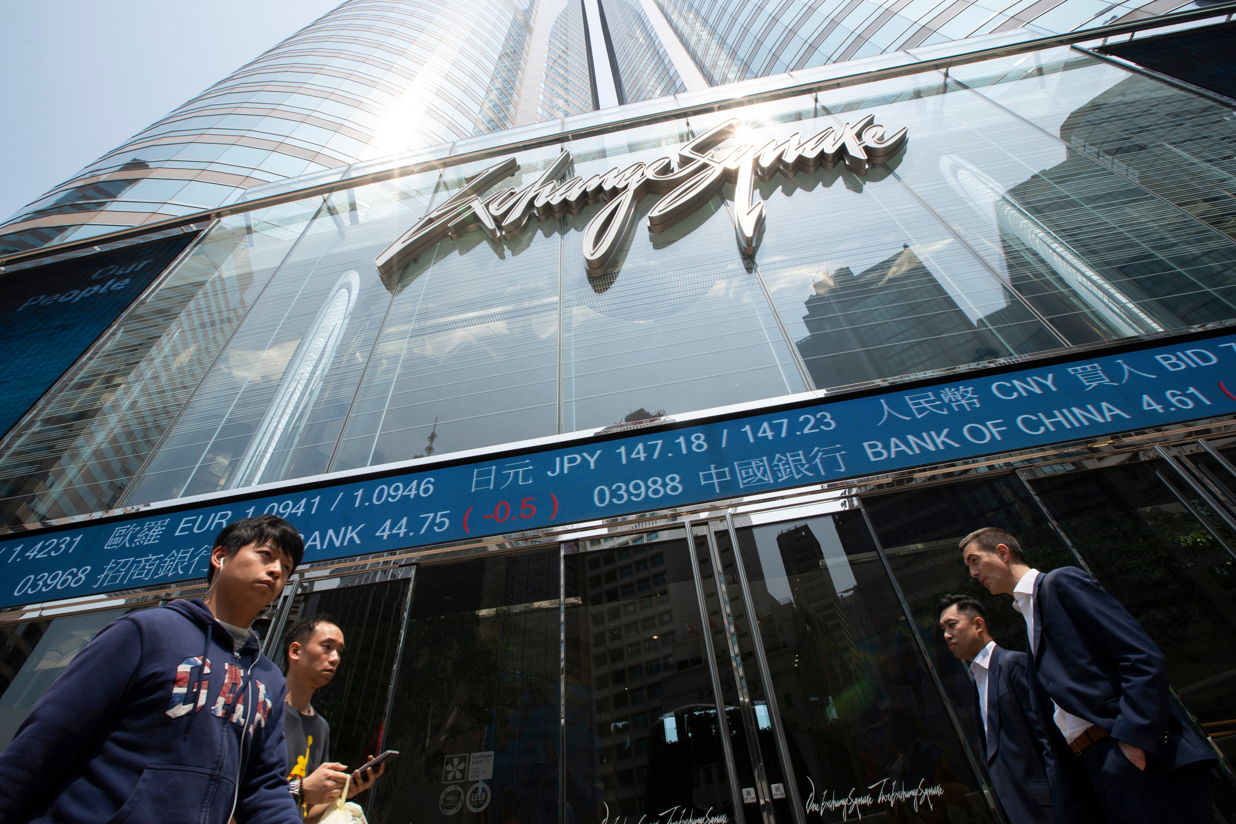 People walk past Exchange Square in Central, home of Hong Kong’s bourse operator Hong Kong Exchanges and Clearing, on April 3, 2025. Photo: Nathan Tsui