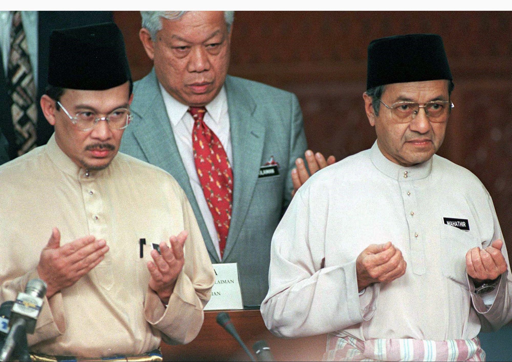 Anwar (left) with then-prime minister Mahathir (right) in parliament in 1997. Photo: Reuters Anwar (left) with then-prime minister Mahathir (right) in parliament in 1997. Photo: Reuters