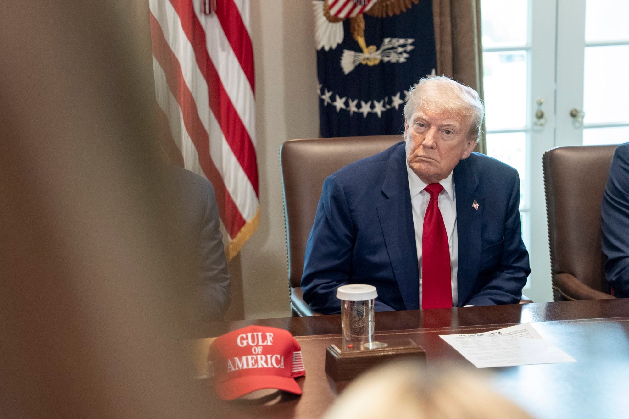 US President Donald Trump listens to remarks during a cabinet meeting at the White House on Wednesday, next to a “Gulf of America” hat. Photo: EPA-EFE US President Donald Trump listens to remarks during a cabinet meeting at the White House on Wednesday, next to a “Gulf of America” hat. Photo: EPA-EFE