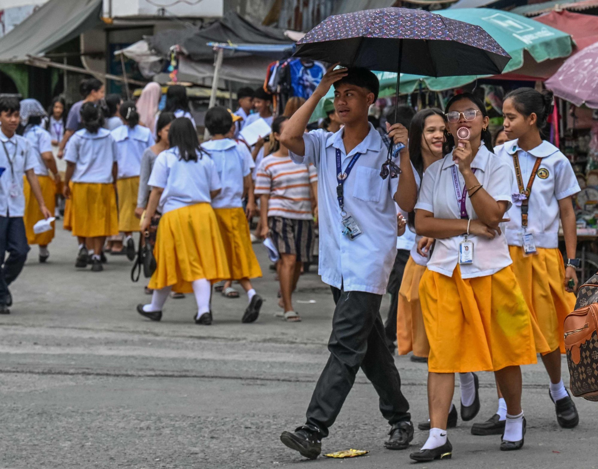 Philippine students outside a high school in Manila. Photo: AFP Philippine students outside a high school in Manila. Photo: AFP