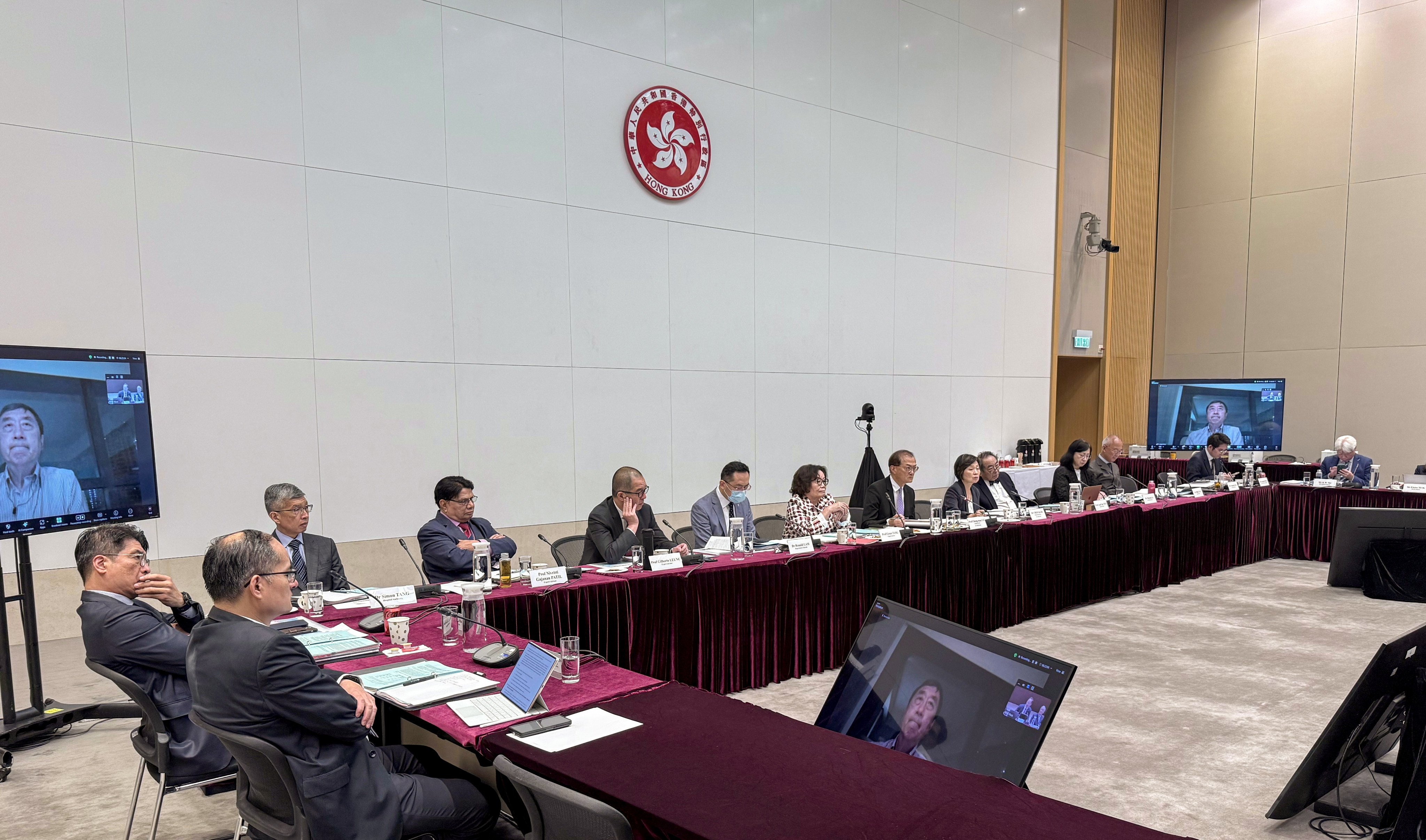Members of the Task Group on New Medical School learn more about the competing universities’ proposals. Photo: Handout