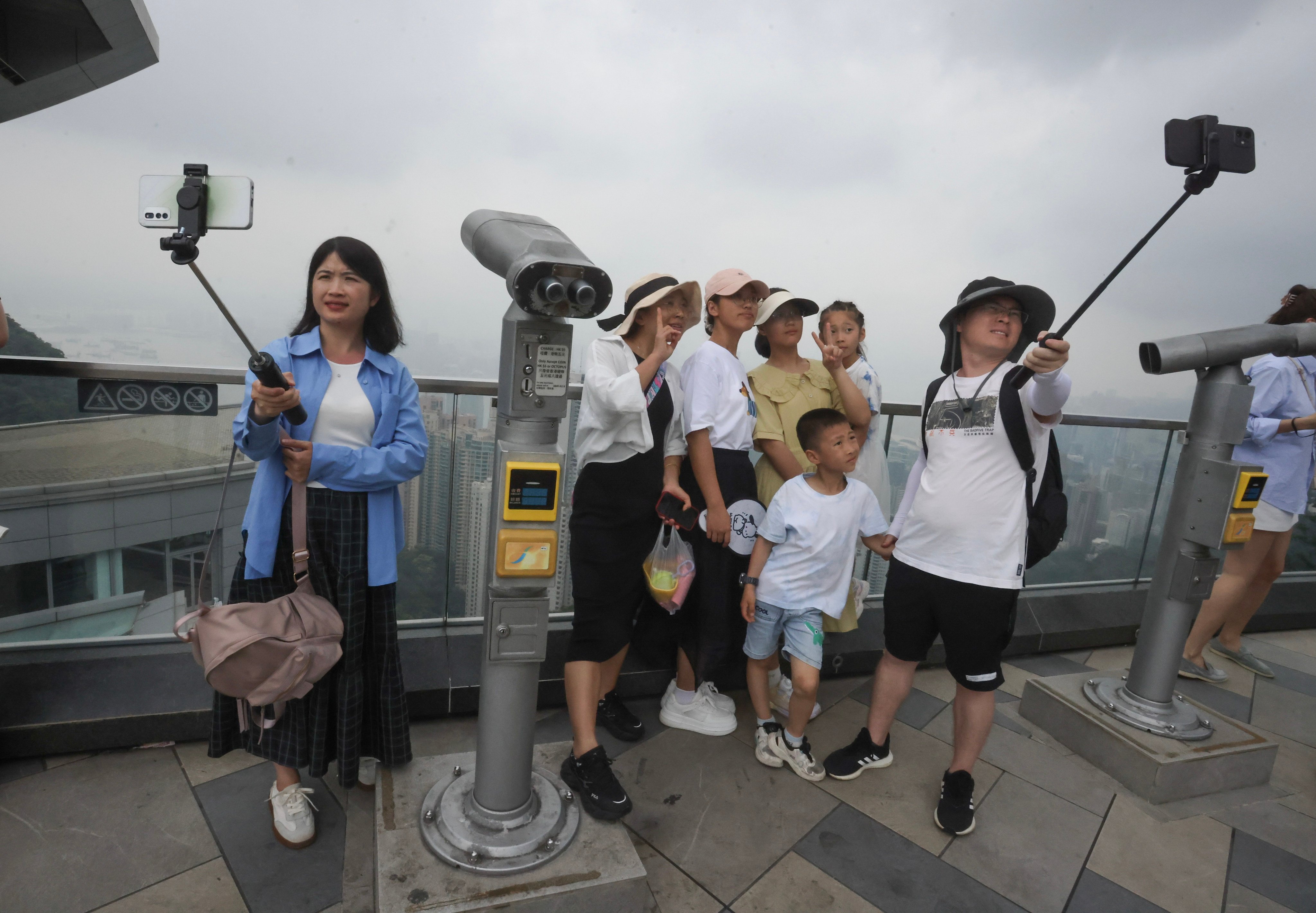Tourists are flocking to popular spots such as the The Peak. Photo: Jonathan Wong