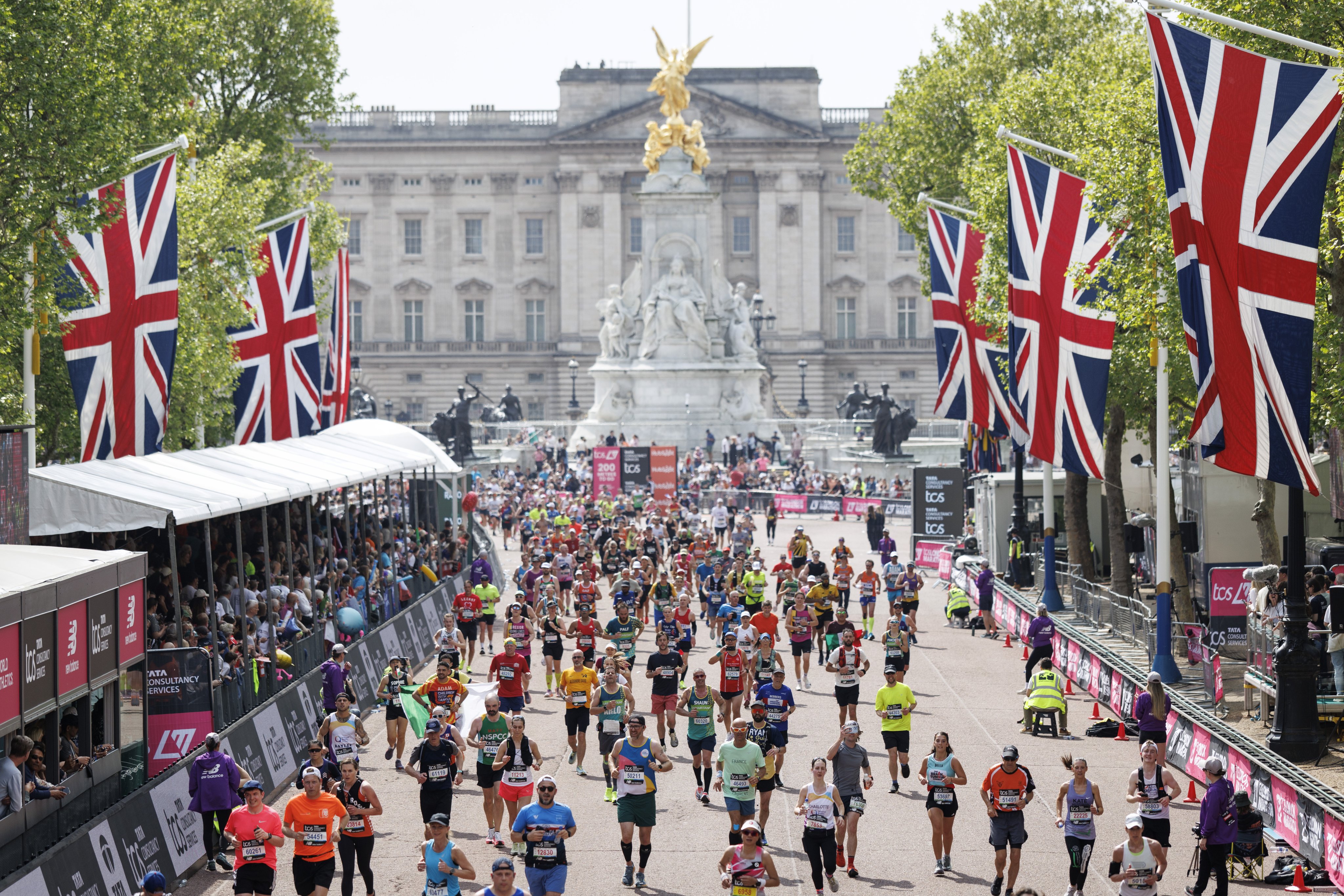 Runners cross the finish line in this year’s London Marathon. Photo: EPA-EFE