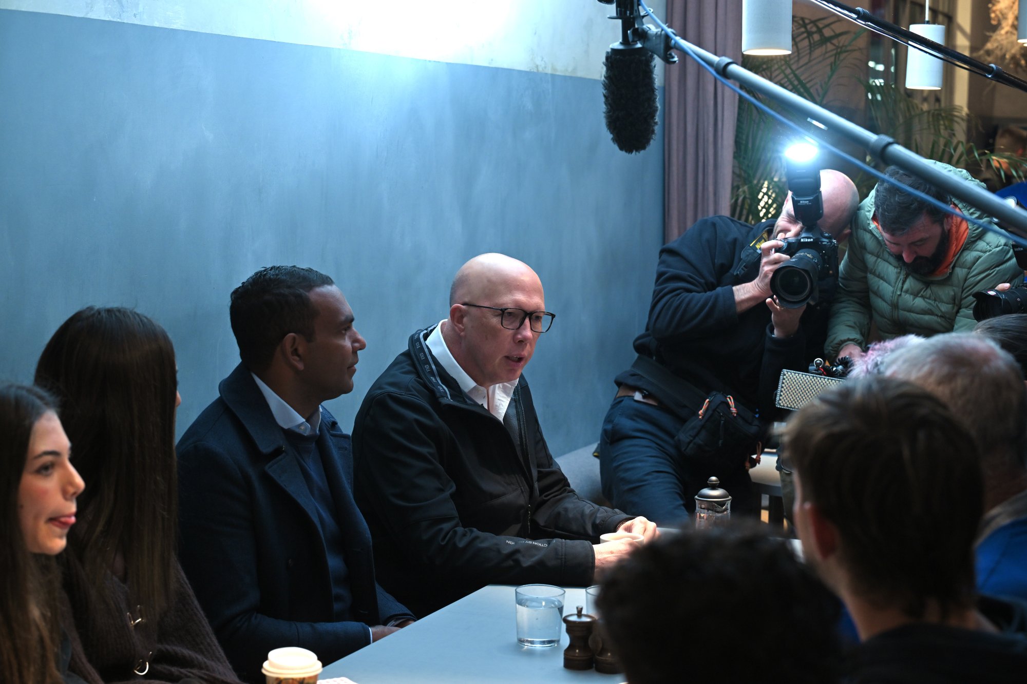 Leader of the Opposition Peter Dutton (centre) speaks at a cafe on Election Day in Melbourne, Australia. Photo: EPA-EFE Leader of the Opposition Peter Dutton (centre) speaks at a cafe on Election Day in Melbourne, Australia. Photo: EPA-EFE