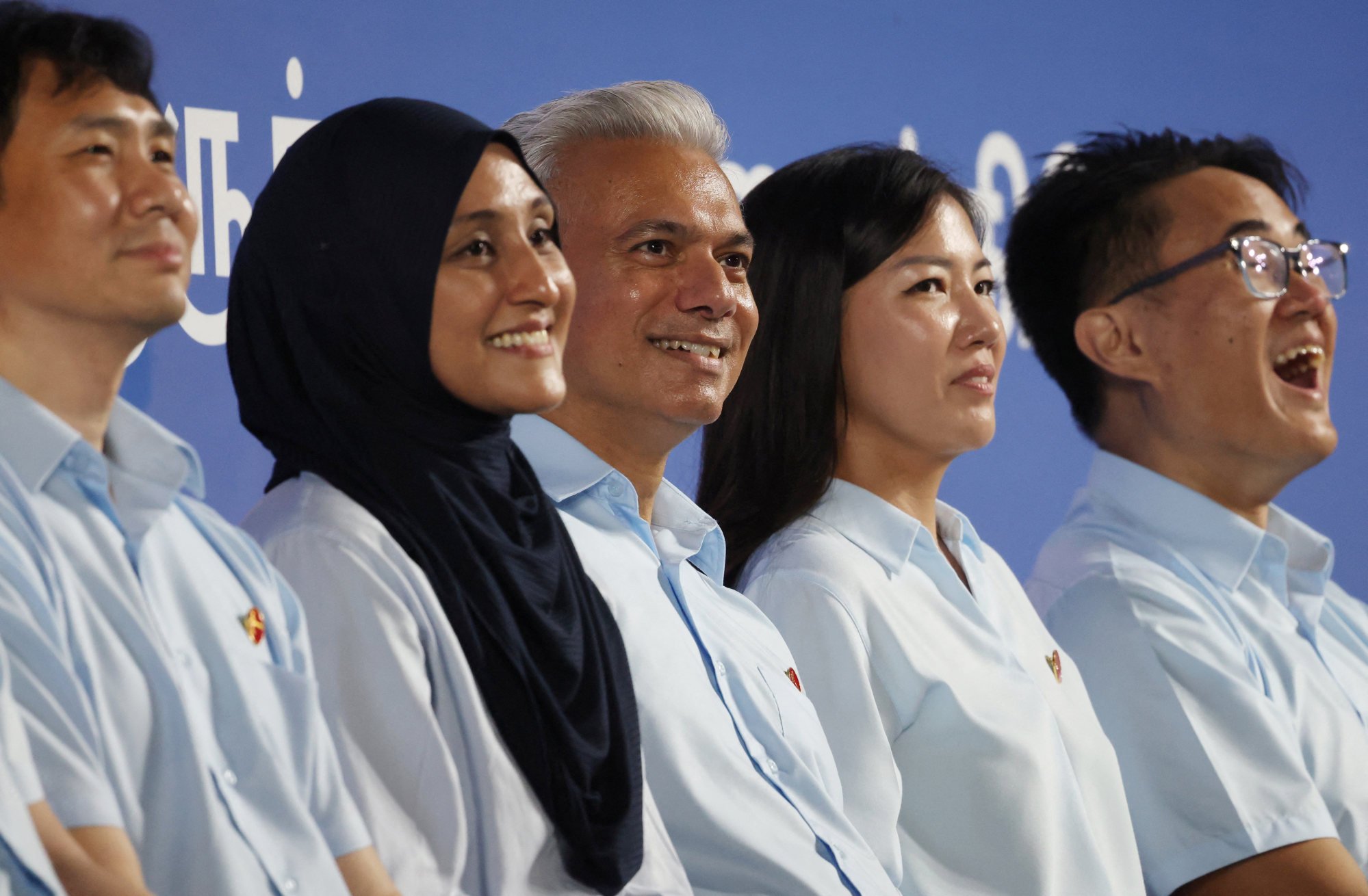 Workers’ Party candidates Jamus Lim, Alia Mattar, Harpreet Singh, Alexis Dang and Jackson Au attend a rally ahead of the general election in Singapore on April 28. Photo: Reuters Workers’ Party candidates Jamus Lim, Alia Mattar, Harpreet Singh, Alexis Dang and Jackson Au attend a rally ahead of the general election in Singapore on April 28. Photo: Reuters