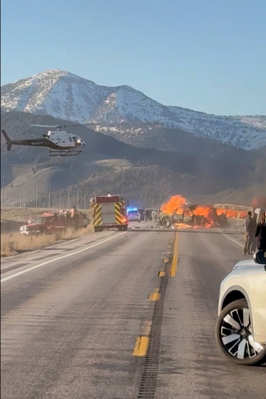 Rescue workers at the scene of a fatal collision between a pickup truck and tour van carrying foreign tourists in Idaho in the United States. Photo: Roger Merrill via AP