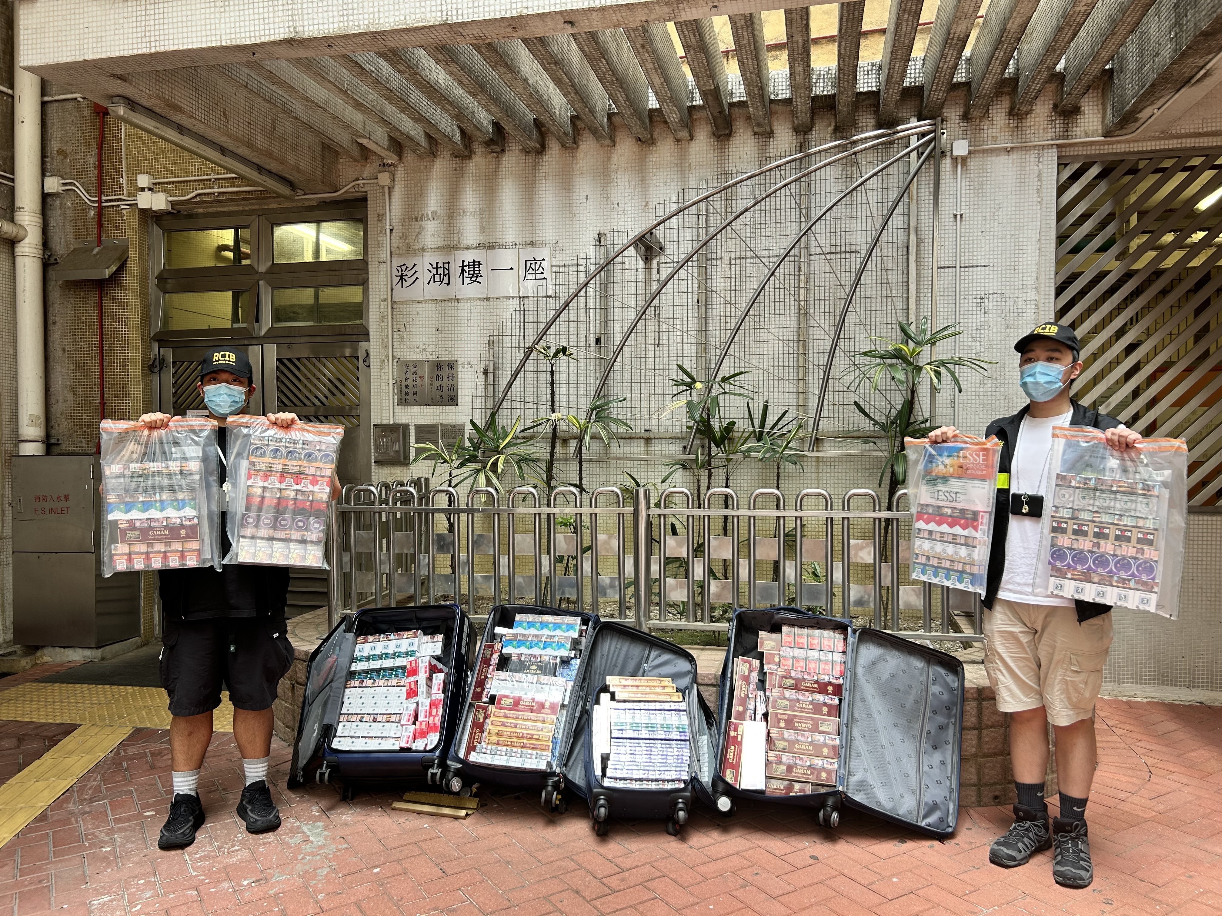Customs officers display goods seized on Sunday after two helpers were intercepted in Sheung Shui. Photo: Handout