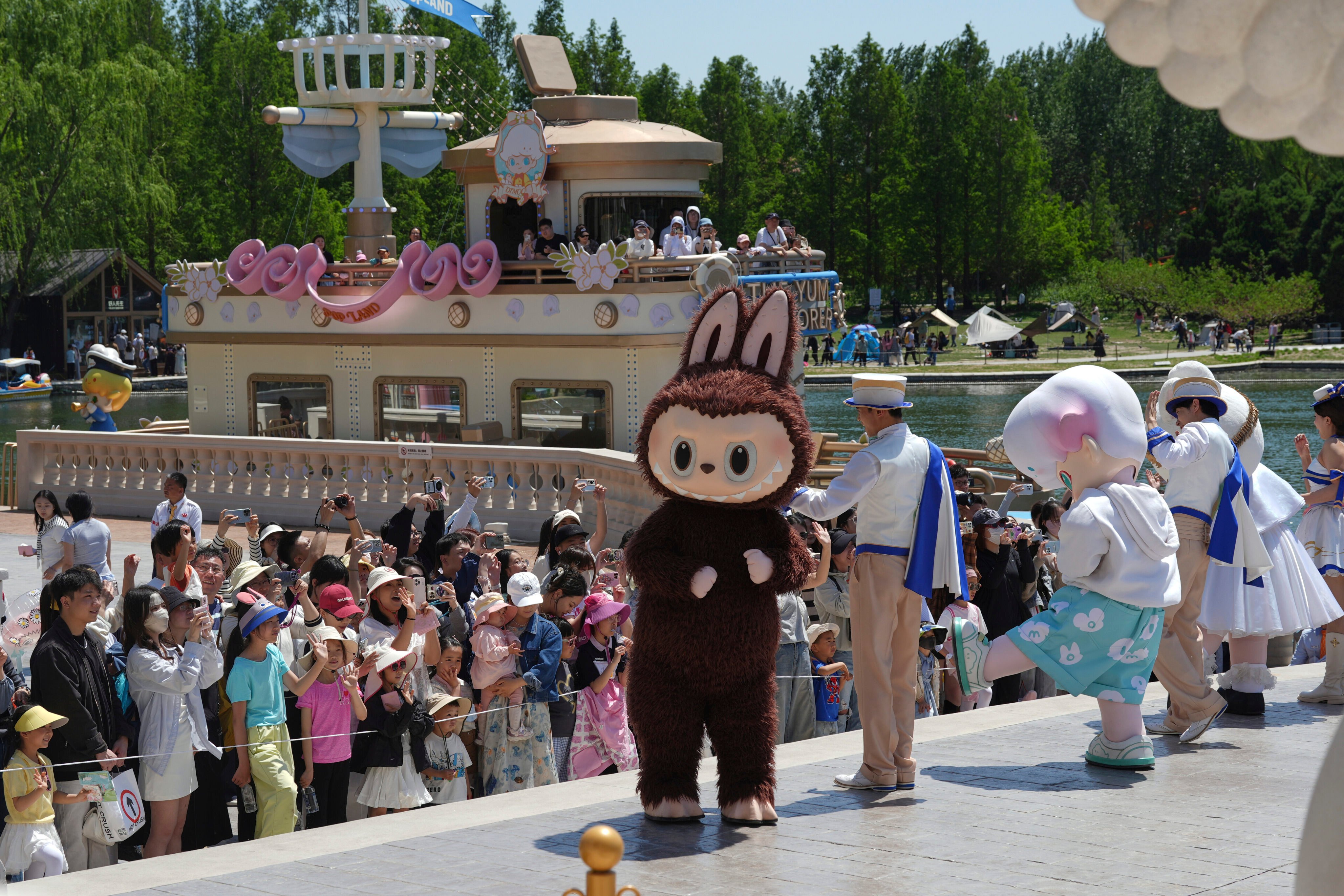 A costumed character performs in Pop Land, a theme park featuring IP like Labubu, in Beijing on May 1. Photo: AP