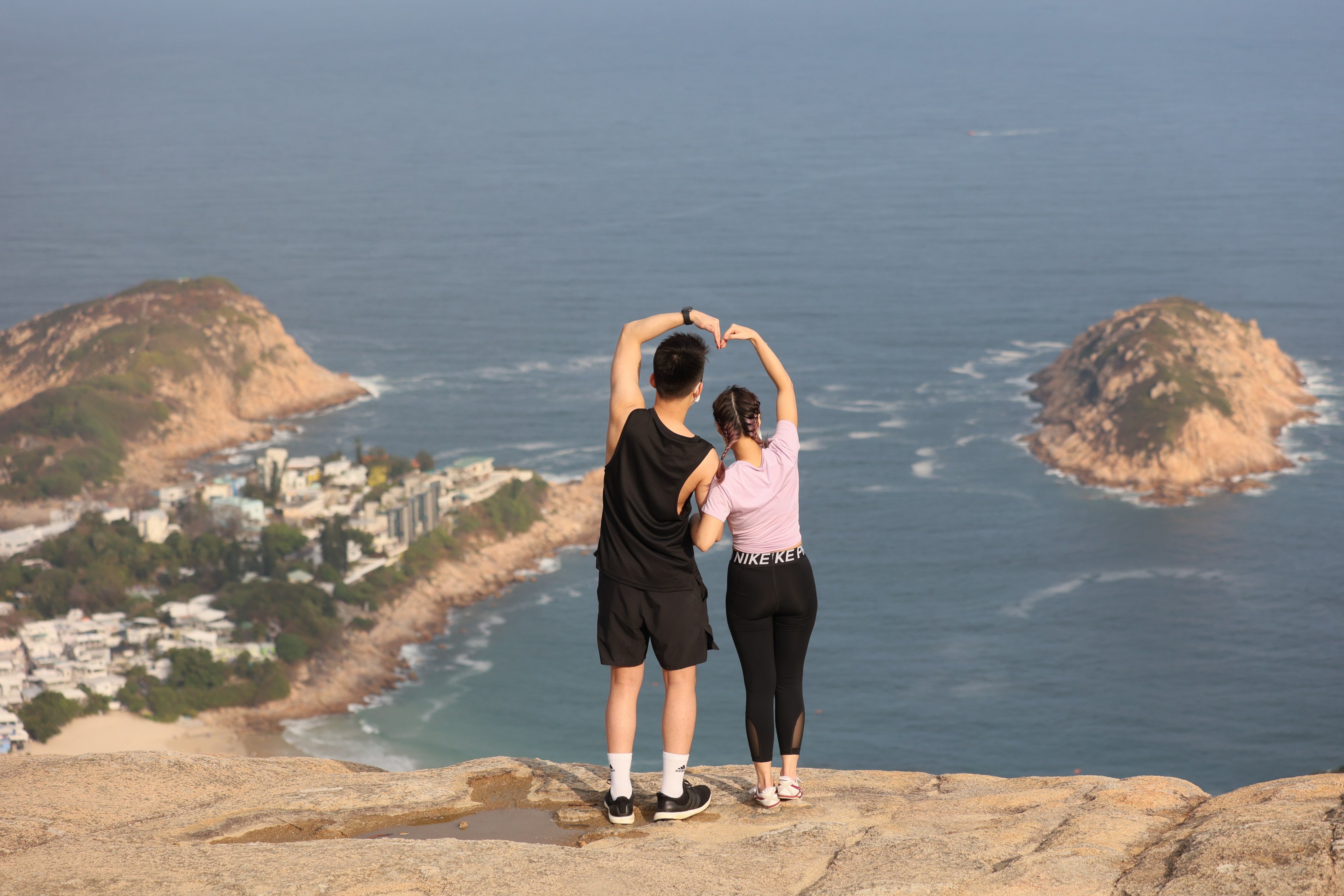 A couple take a photo while hiking the Dragon’s Back trail in Shek O on February 13, 2021. Photo: Dickson Lee