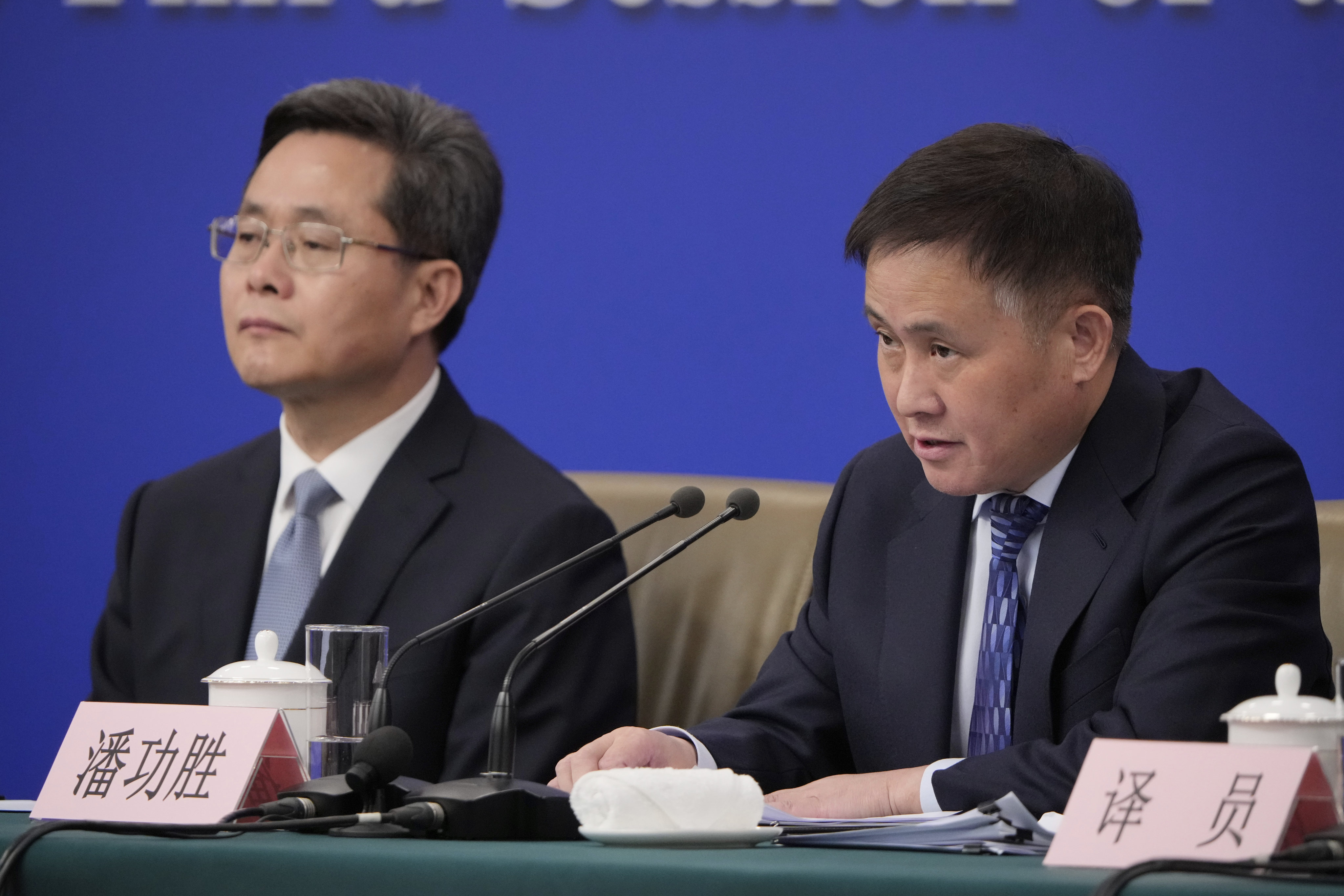 Pan Gongsheng (right), governor of the People’s Bank of China, speaks as Lan Foan, China’s finance minister, looks on during a presser on the sidelines of the National People’s Congress in Beijing on March 6. Photo: AP