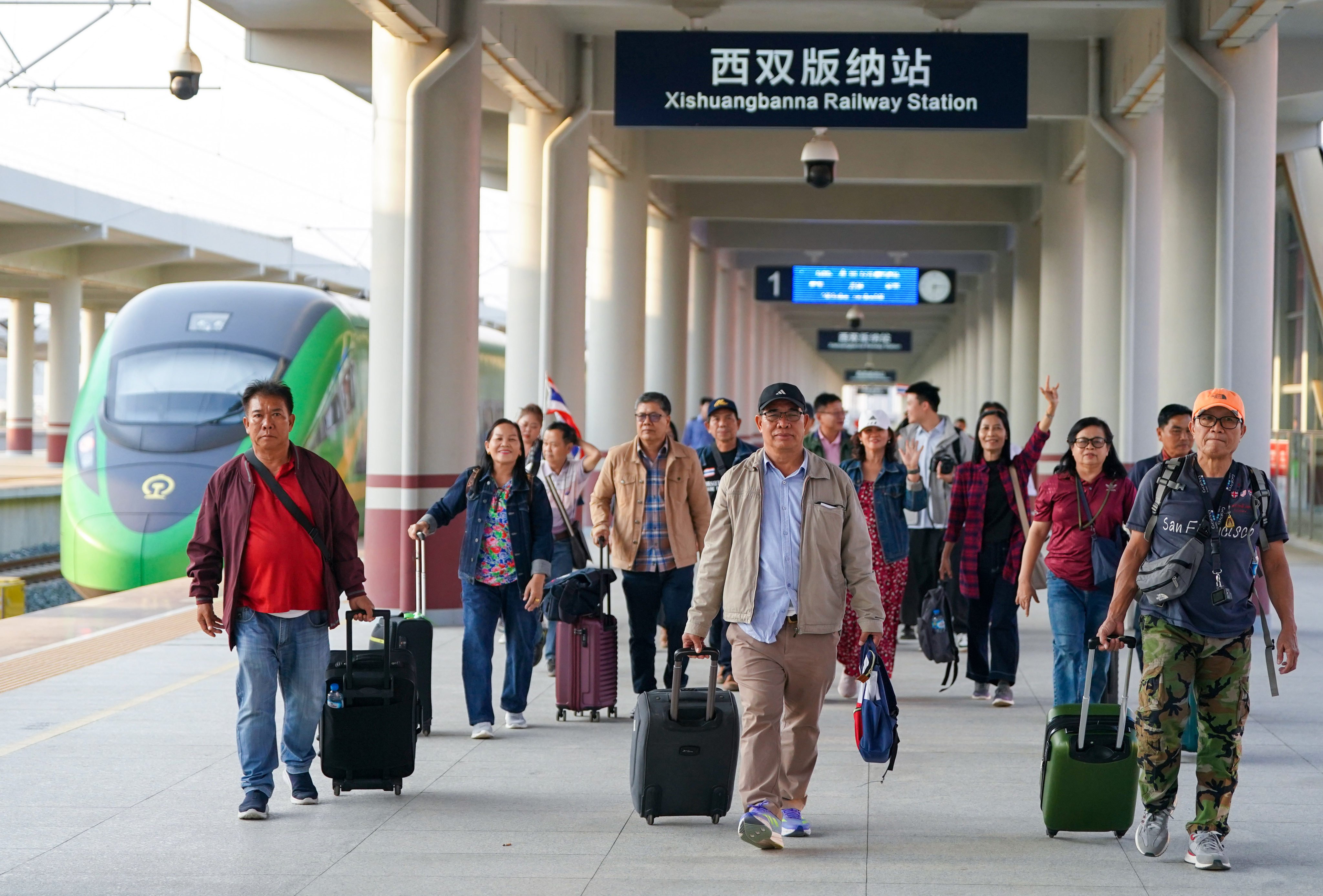 Tourists from Laos and Thailand arrive at a railway station in southwest China’s Yunnan province in February. Photo: Xinhua