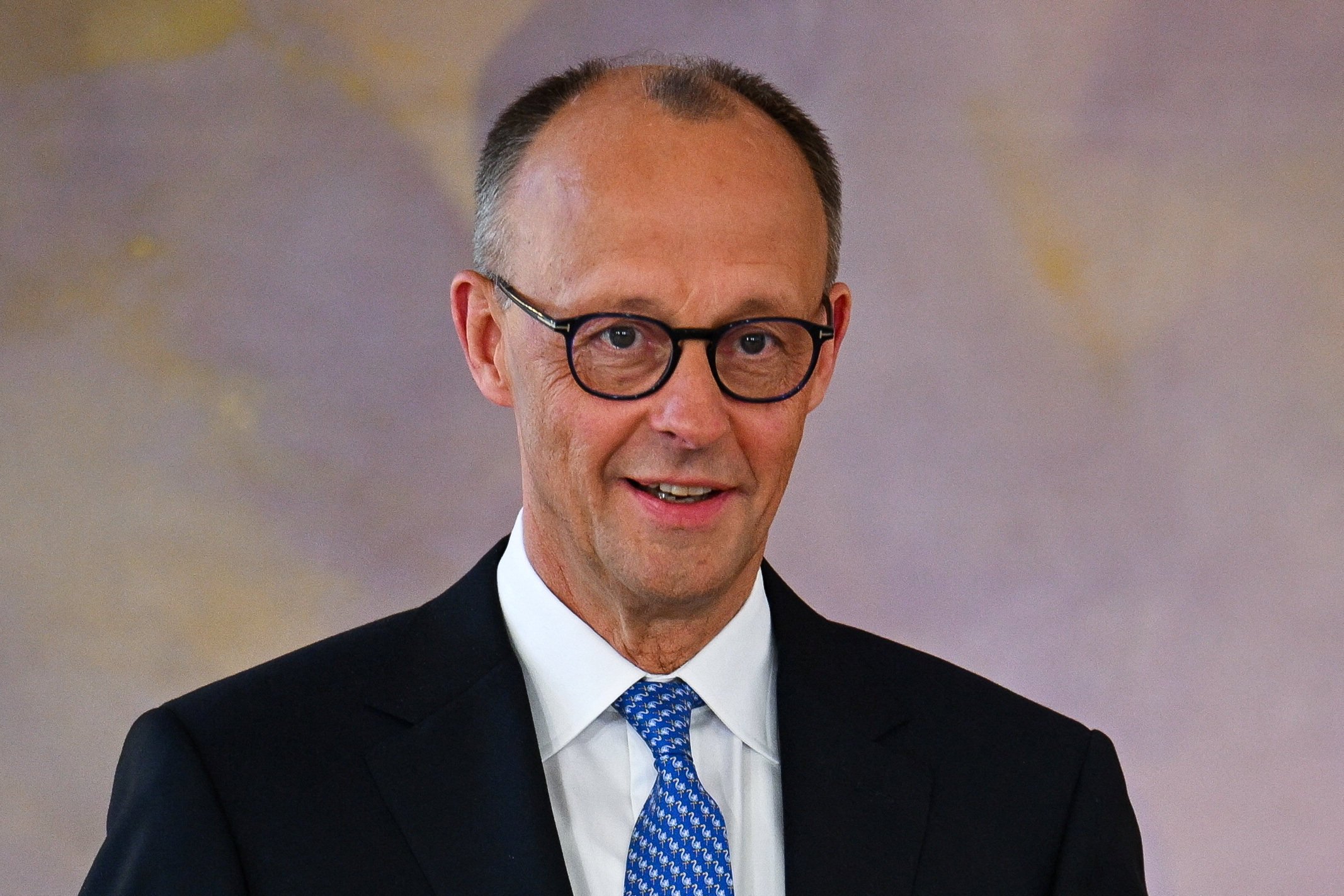 Friedrich Merz reacts as he receives his certificate of appointment from German President Frank-Walter Steinmeier in Berlin, Germany on Tuesday. Photo: Reuters