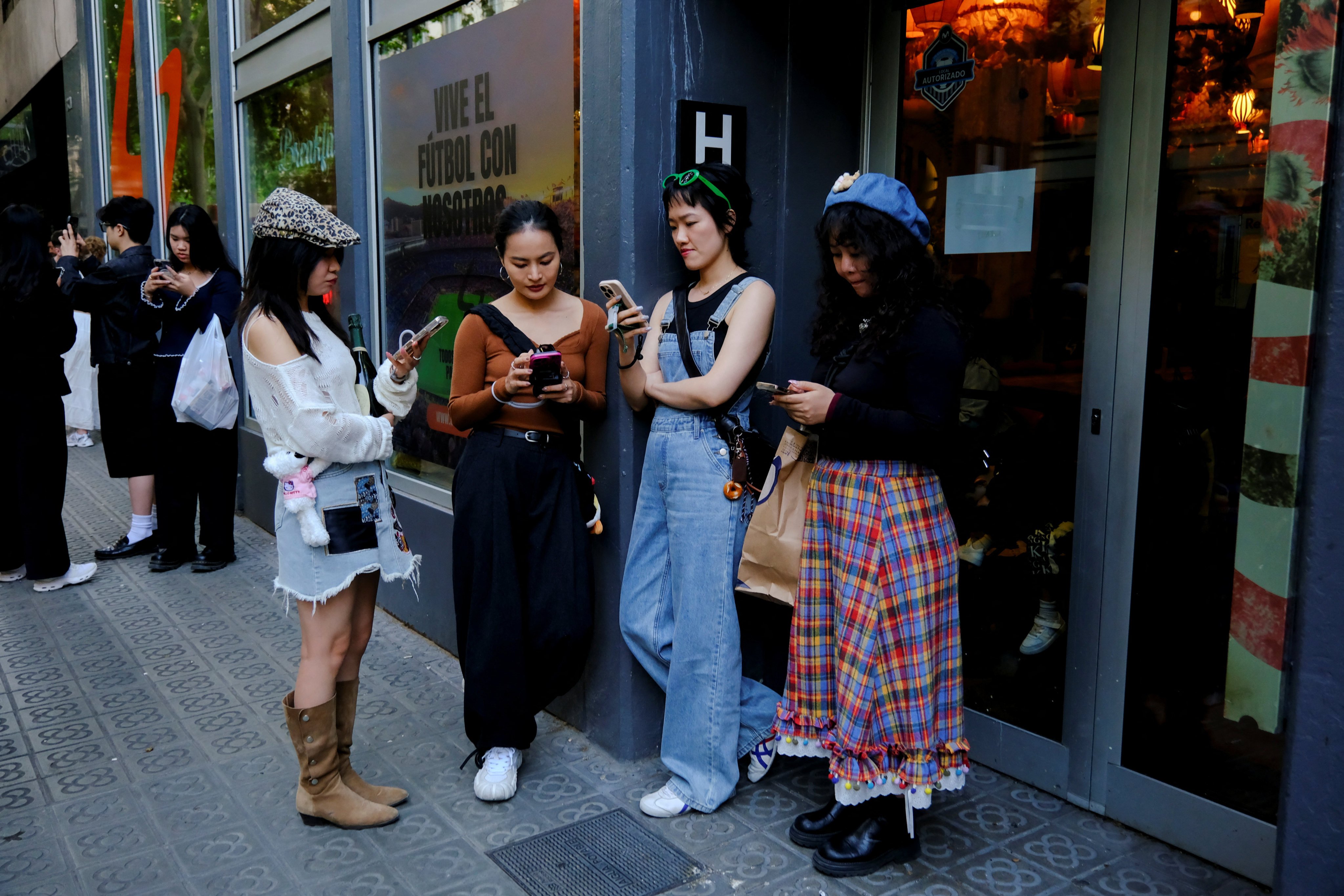 Chinese tourists in Barcelona, Spain, on April 28.  Some Hongkongers are now going on overseas trips via mainland China, and one reason is the much lower prices. Photo: Reuters