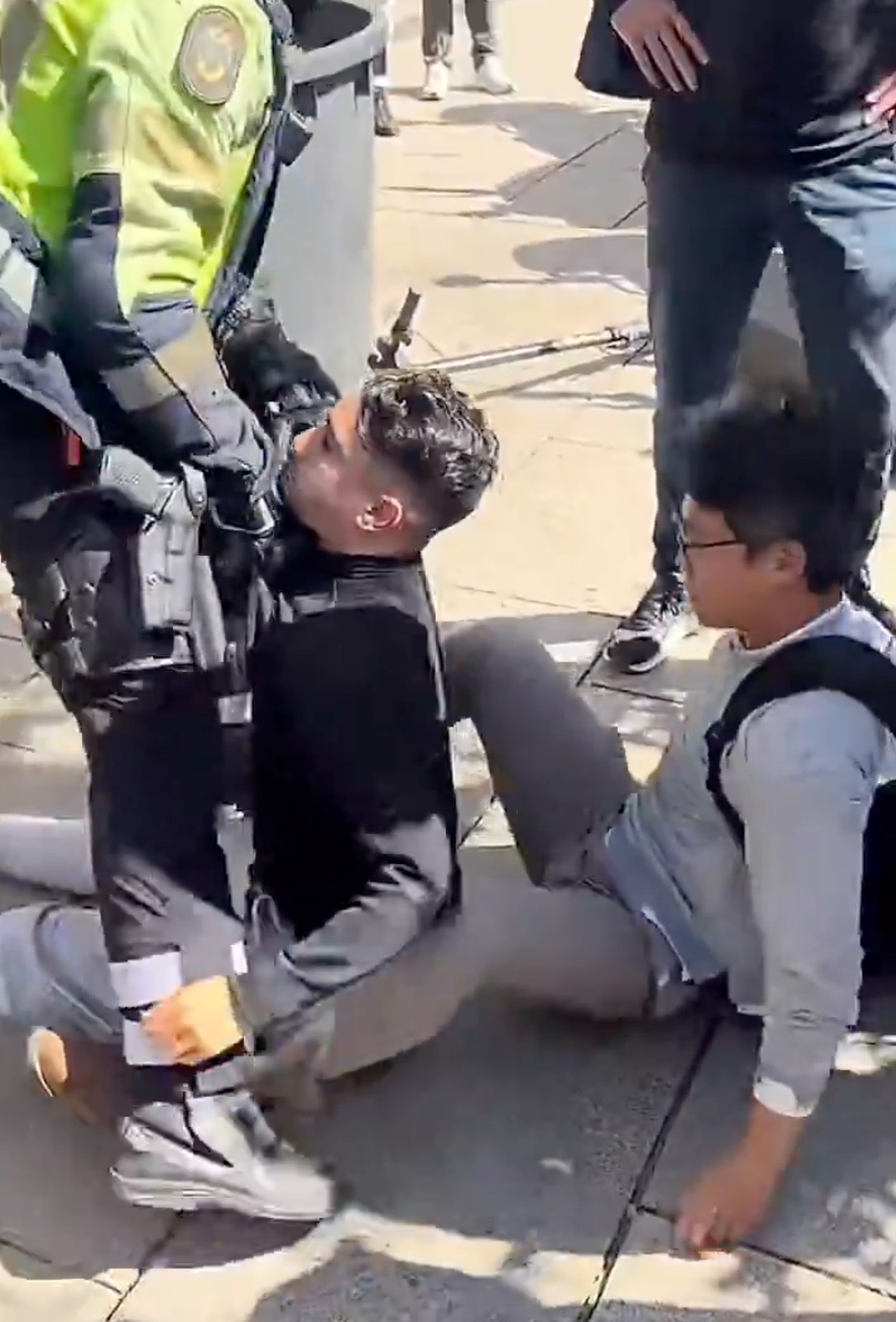 The thief was arrested by police officers after Tian loosened his chokehold. Photo: Handout