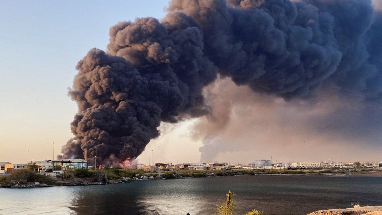 A large plume of smoke rises from a fuel depot in Port Sudan on Tuesday. Photo: Reuters