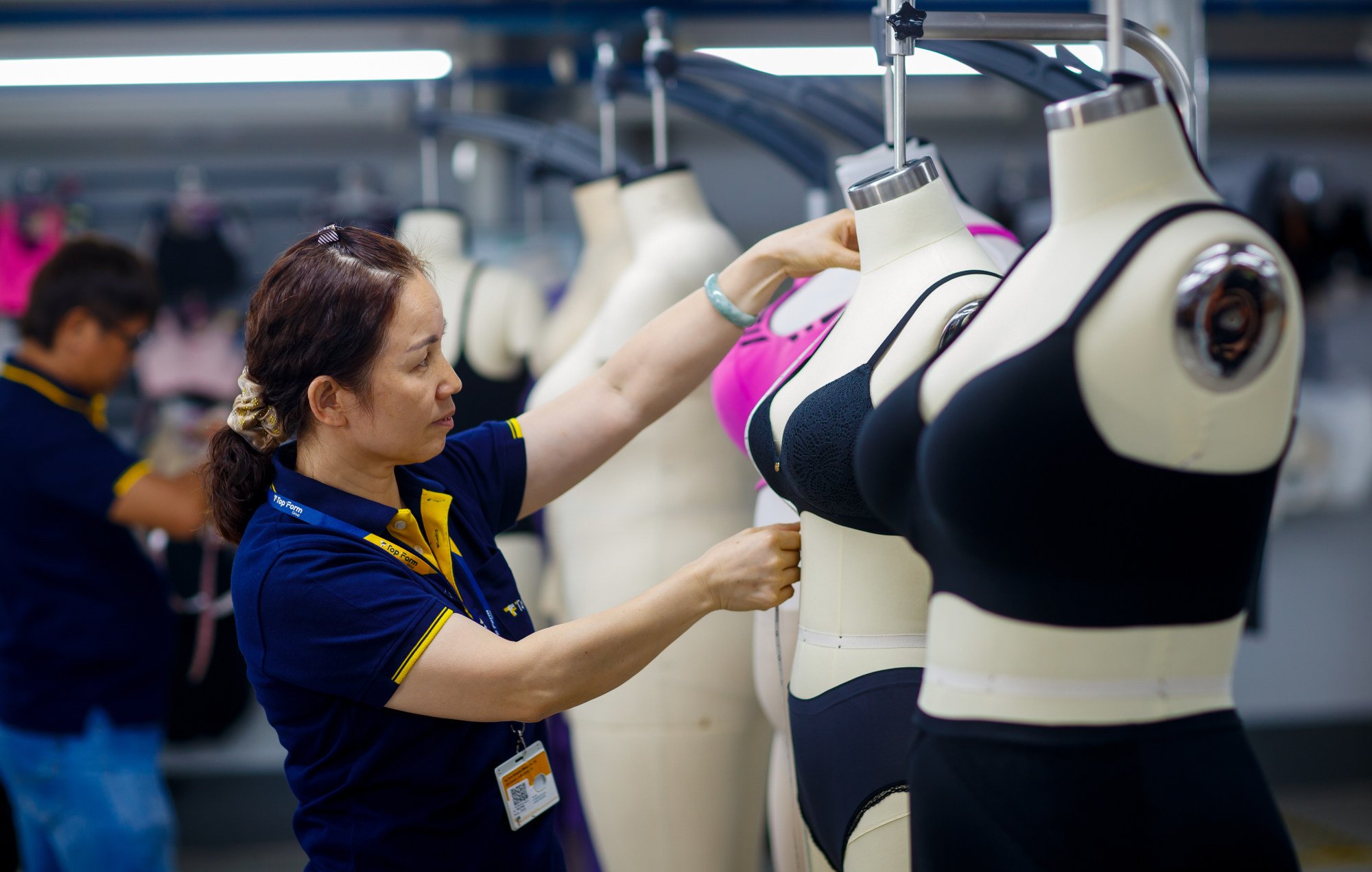A worker makes adjustments to newly-produced bras at Top Form’s Mae Sot factory. Photo: Handout