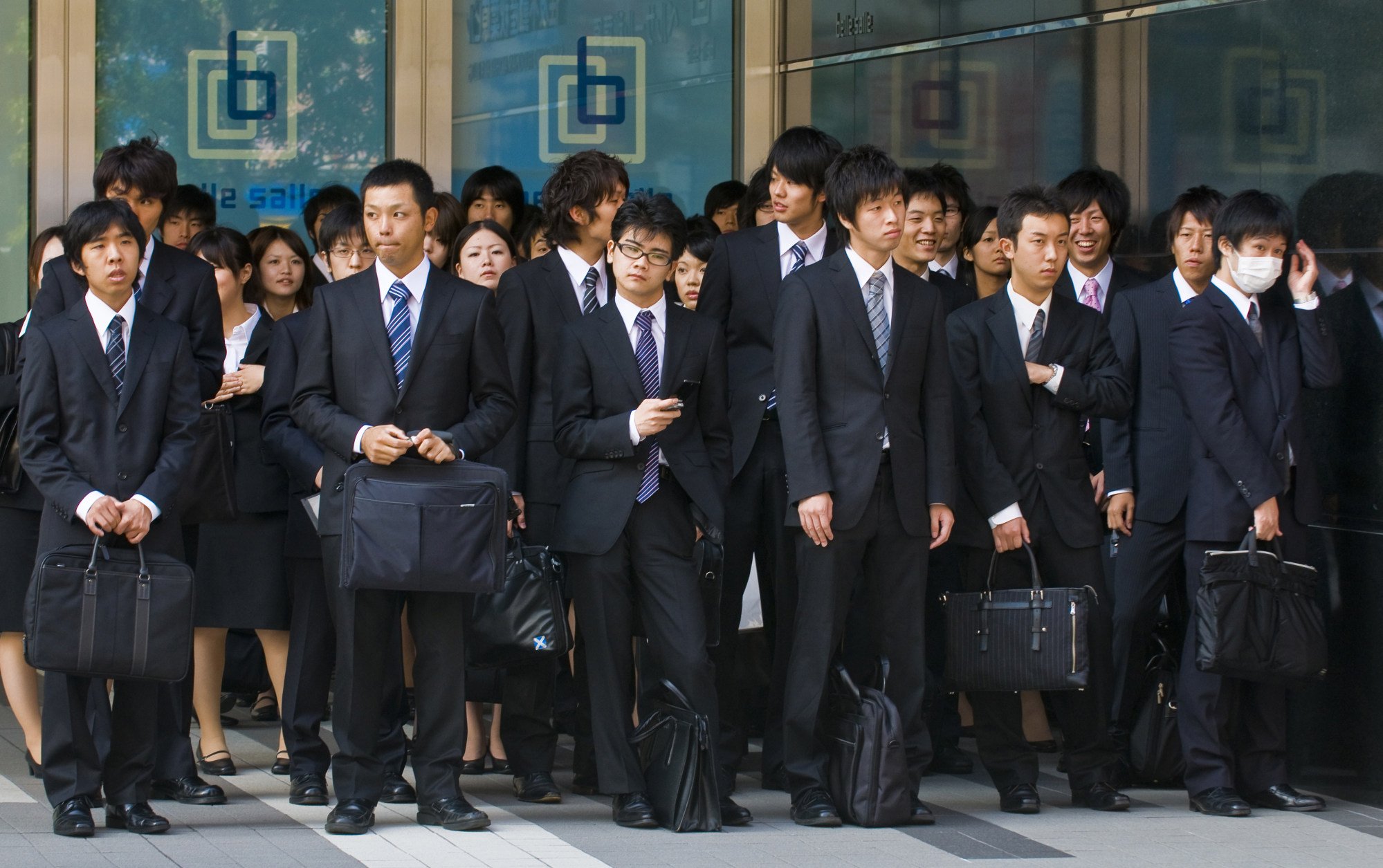 Office workers in Tokyo’s financial district. Photo: Shutterstock Office workers in Tokyo’s financial district. Photo: Shutterstock
