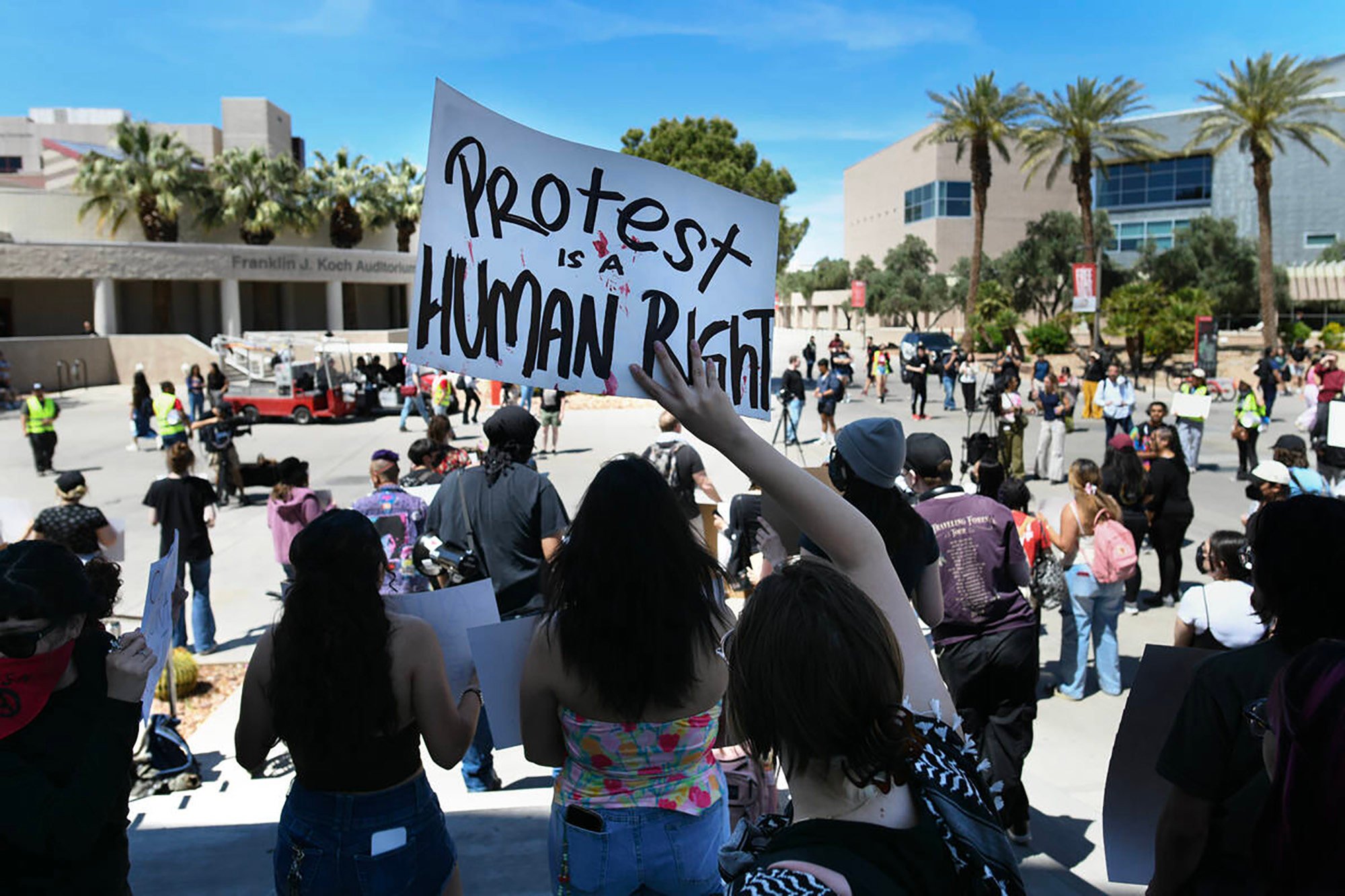 A student waves a sign during a University of Nevada, Las Vegas, rally to demand the university protect students regardless of immigration status on April 24. Photo: TNS A student waves a sign during a University of Nevada, Las Vegas, rally to demand the university protect students regardless of immigration status on April 24. Photo: TNS