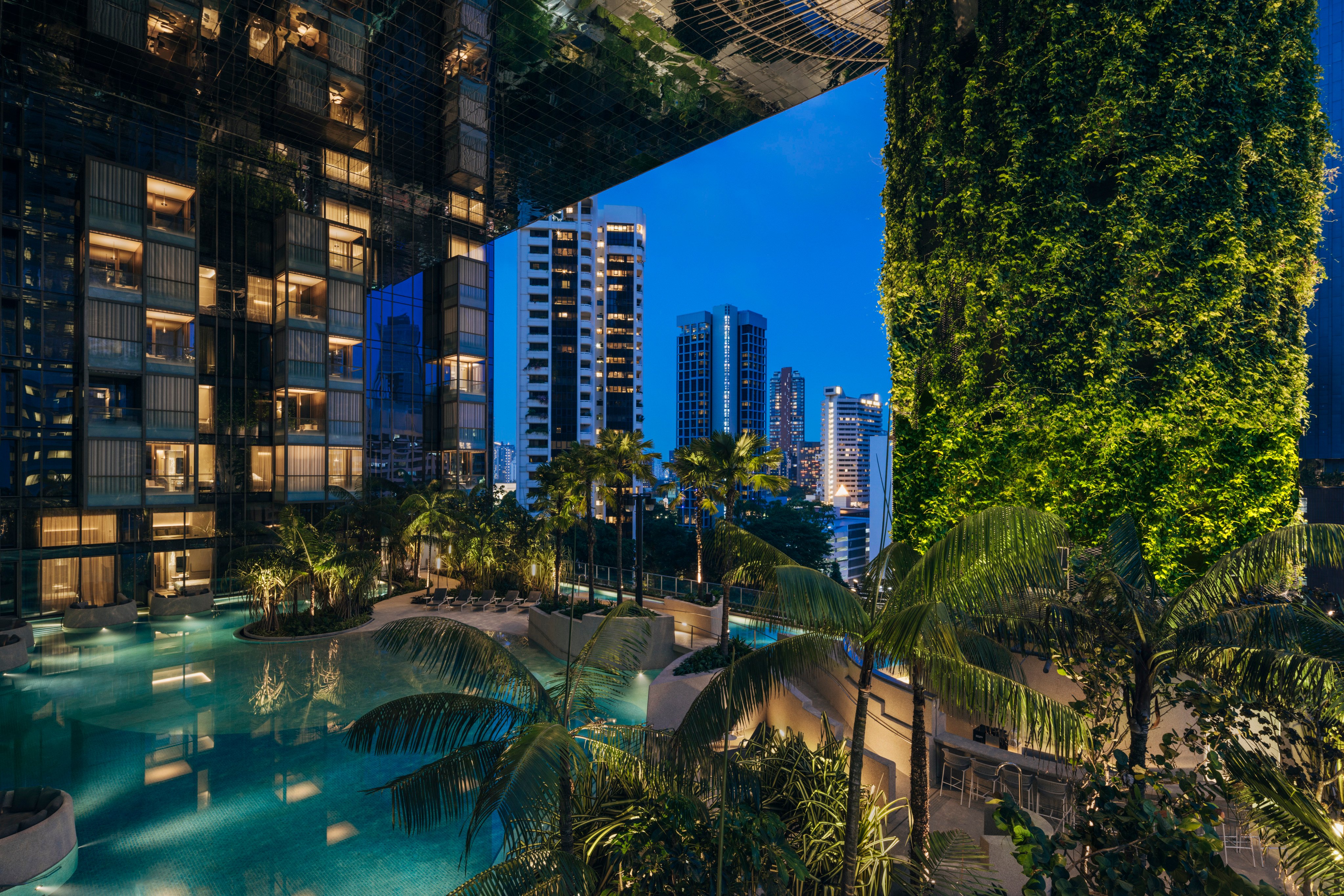 The pool area at Pan Pacific Orchard is surrounded by greenery. Photo: Studio Periphery