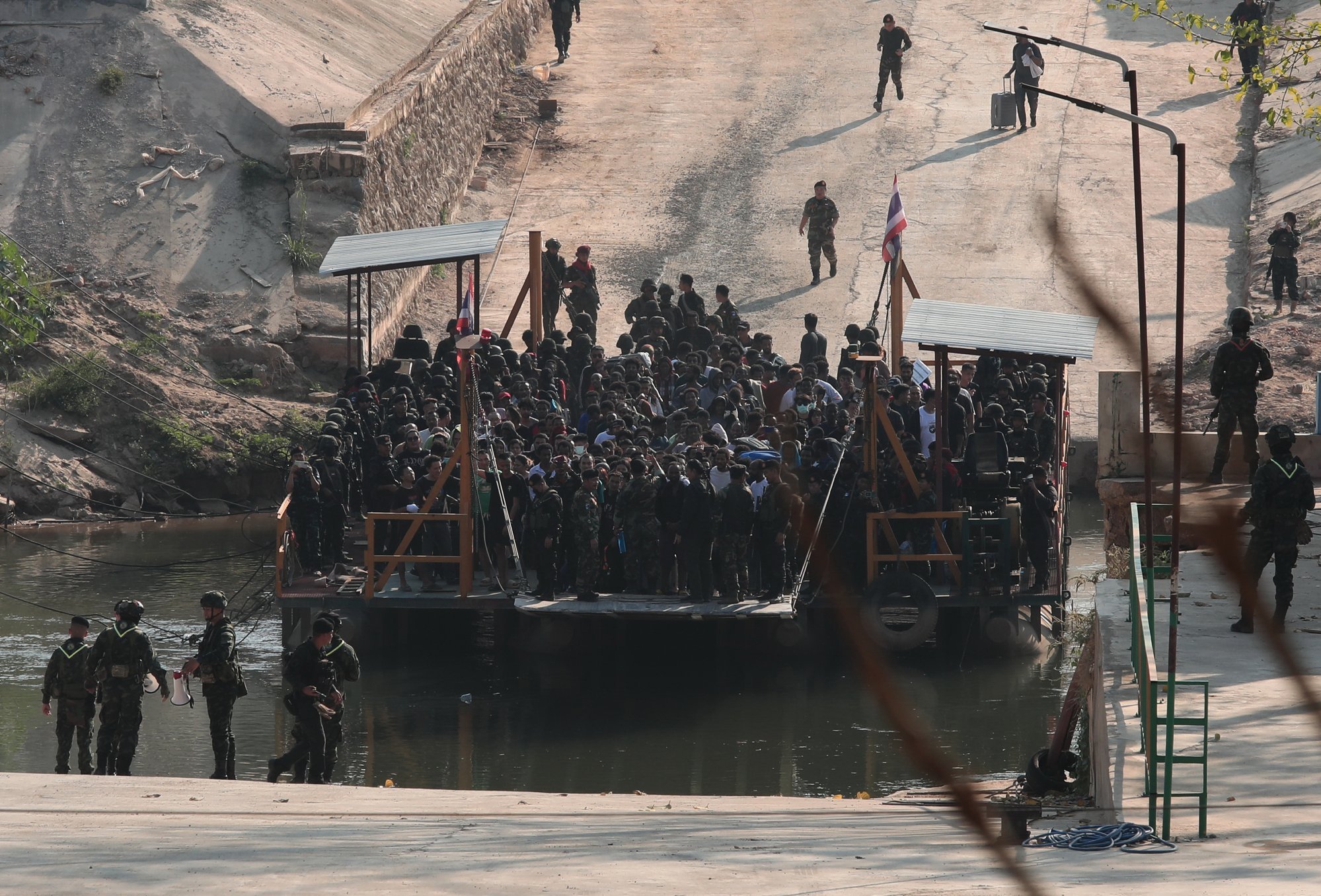 People rescued from scam centres cross from Myanmar to Thailand at a border district in February. Photo: EPA-EFE People rescued from scam centres cross from Myanmar to Thailand at a border district in February. Photo: EPA-EFE