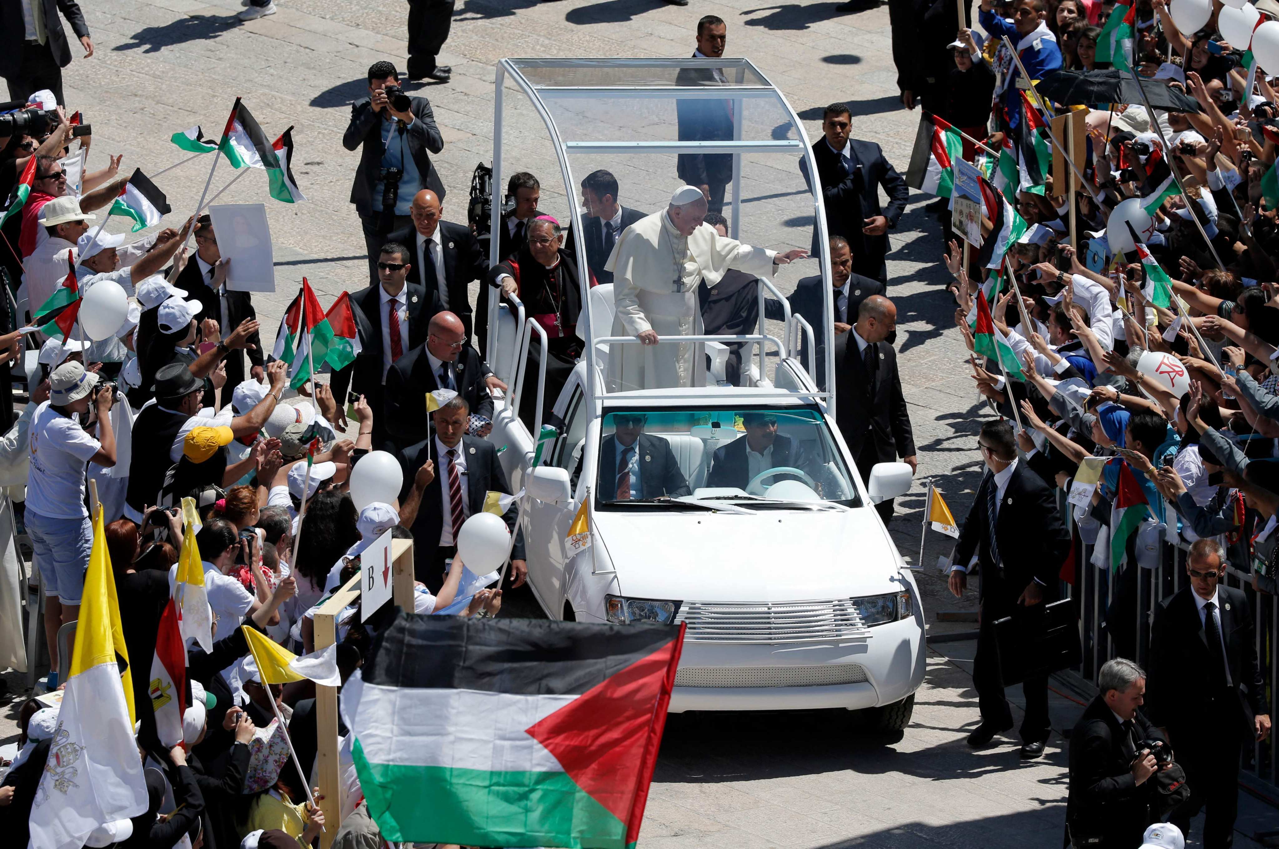 Pope Francis waves to the crowd from his popemobile in Bethlehem, West Bank in 2014. File photo: AFP