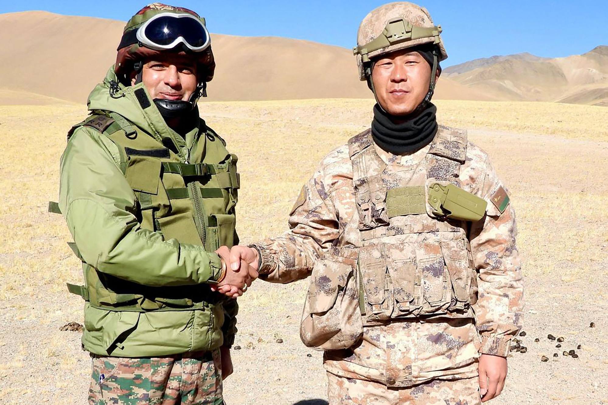 An Indian soldier shakes hands with his Chinese counterpart along the Line of Actual Control near Karakoram Pass in Ladakh in October 2024. Photo: Indian Army / AFP An Indian soldier shakes hands with his Chinese counterpart along the Line of Actual Control near Karakoram Pass in Ladakh in October 2024. Photo: Indian Army / AFP