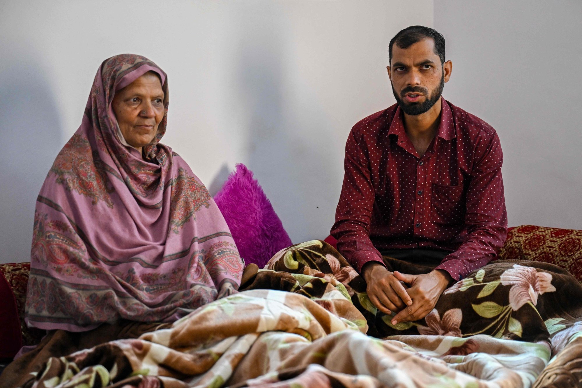 Faisal Majeed (right), sits beside his mother, Nasheen Akhtar. Photo: AFP Faisal Majeed (right), sits beside his mother, Nasheen Akhtar. Photo: AFP