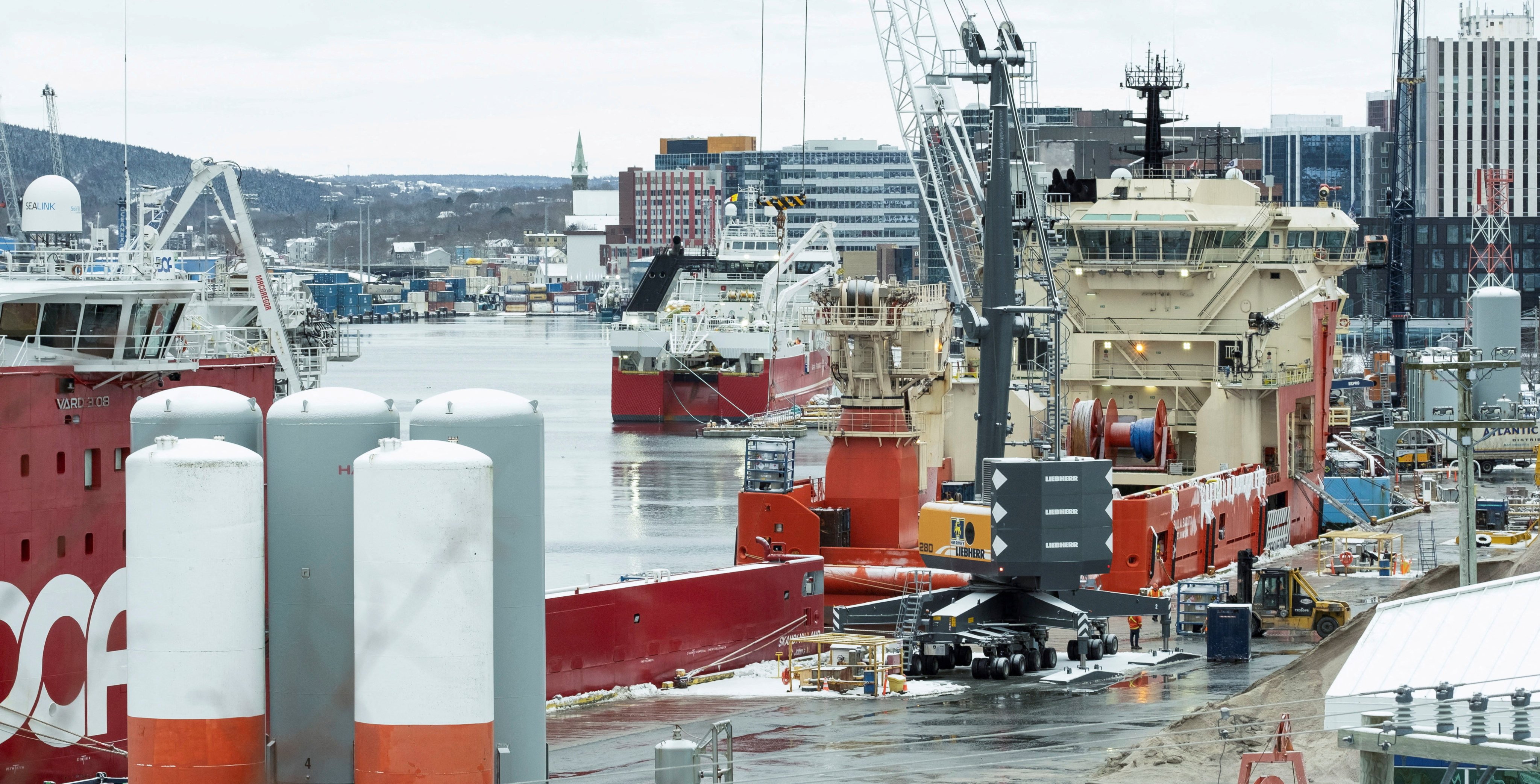 Supply ships that service offshore oil rigs on Canada’s east coast load cargo in St John’s, Newfoundland, in February. Photo: Reuters
