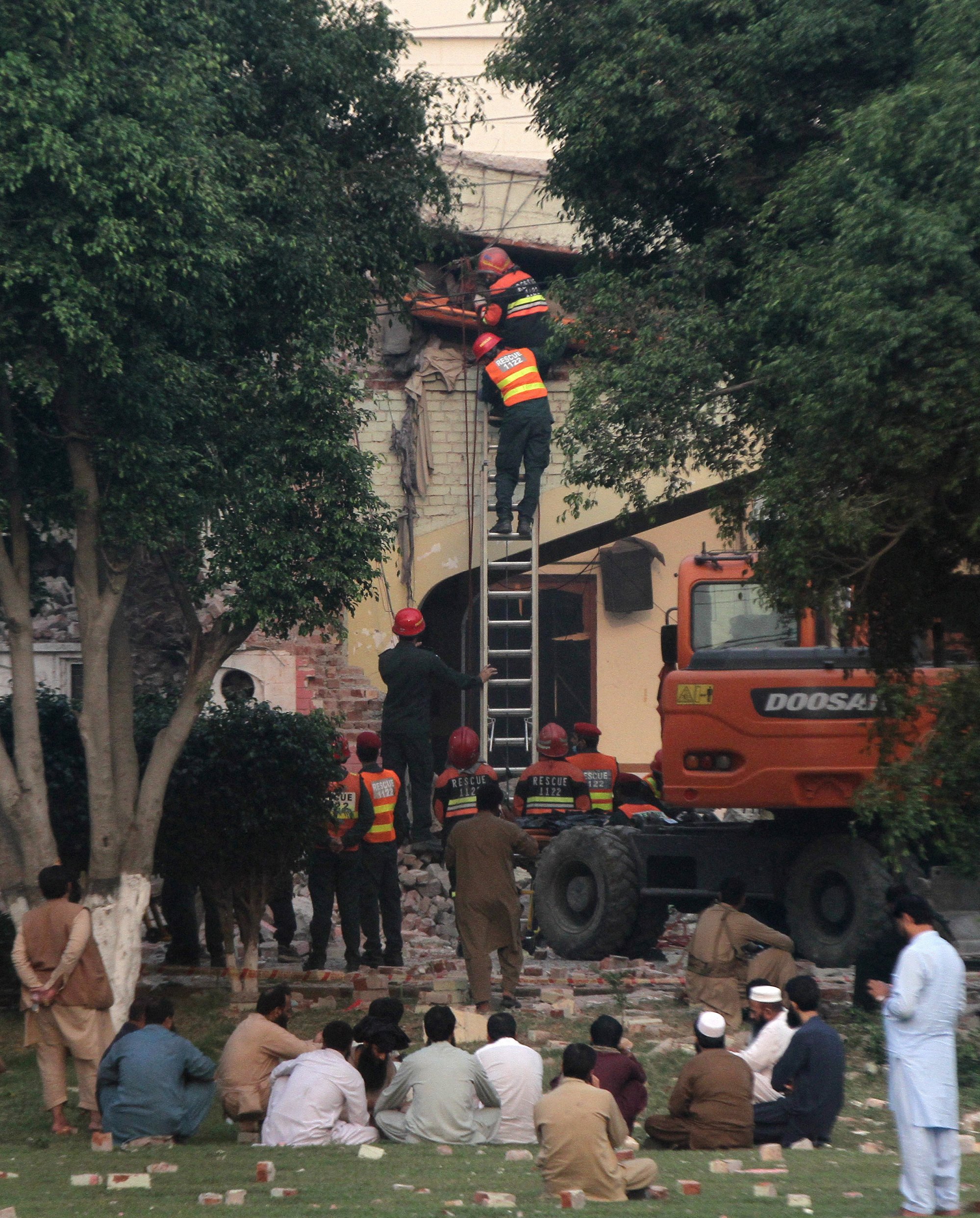 Rescuers remove a body from a damaged building after it was hit by an Indian strike in Muridke near Lahore, Pakistan, on Wednesday. Photo: Reuters Rescuers remove a body from a damaged building after it was hit by an Indian strike in Muridke near Lahore, Pakistan, on Wednesday. Photo: Reuters