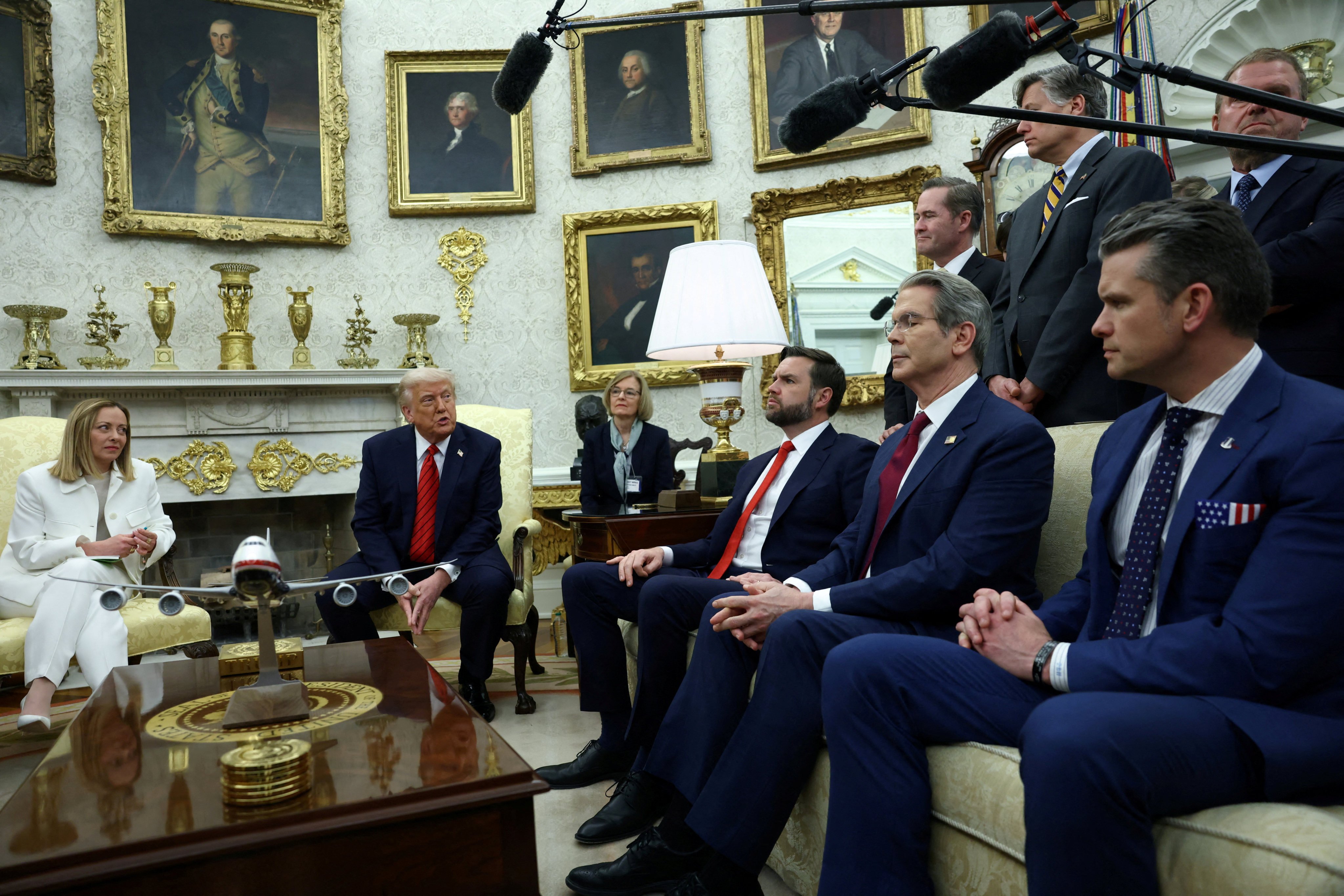 US President Donald Trump meets Italian Prime Minister Giorgia Meloni as US Vice-President J.D. Vance, Treasury Secretary Scott Bessent and Defence Secretary Pete Hegseth sit next to them in the Oval Office at the White House on April 17. Photo: Reuters