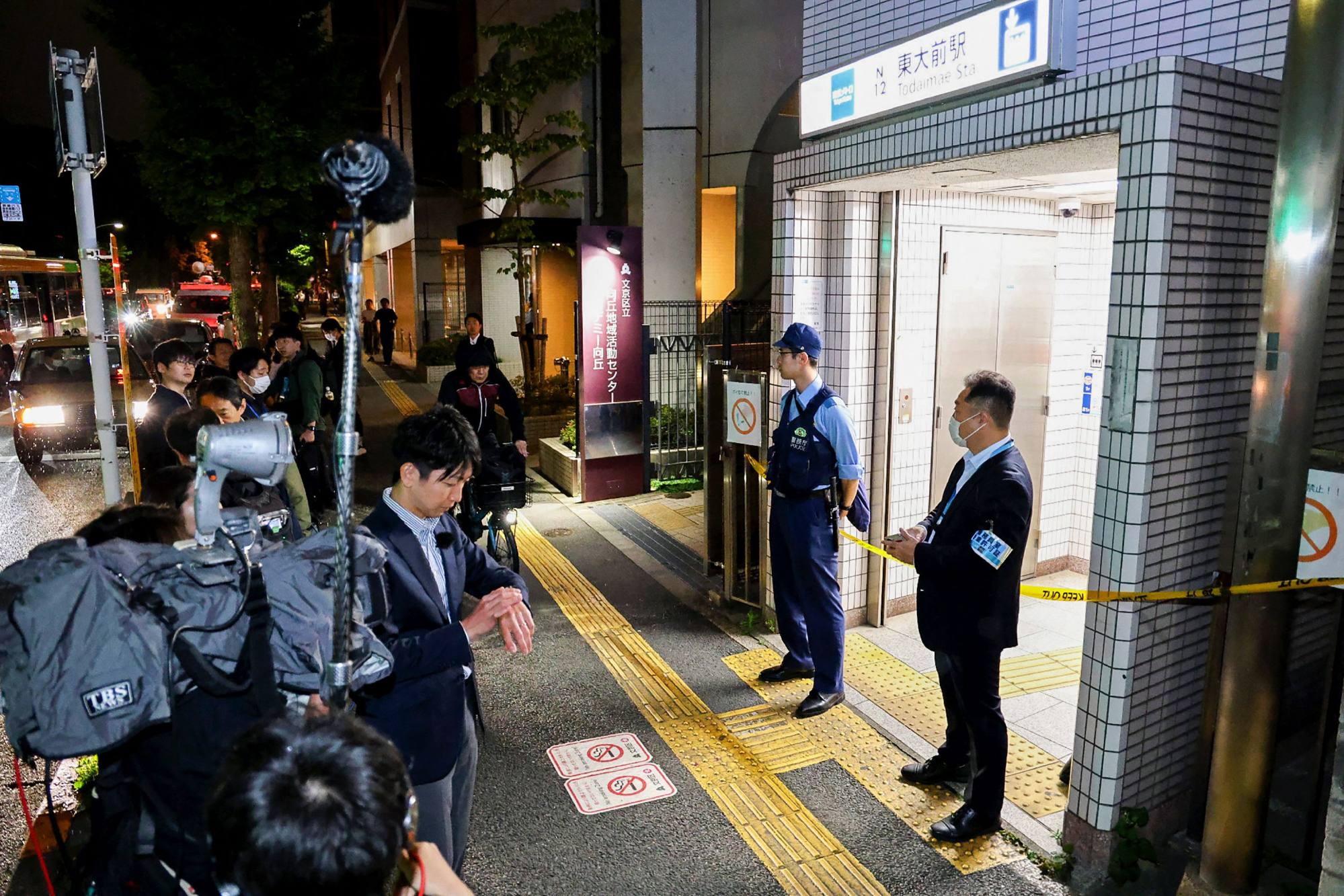 Police officers stand guard at an entrance of Todaimae Station on Tokyo Metro’s Namboku Line after a stabbing incident. Photo: AFP Police officers stand guard at an entrance of Todaimae Station on Tokyo Metro’s Namboku Line after a stabbing incident. Photo: AFP
