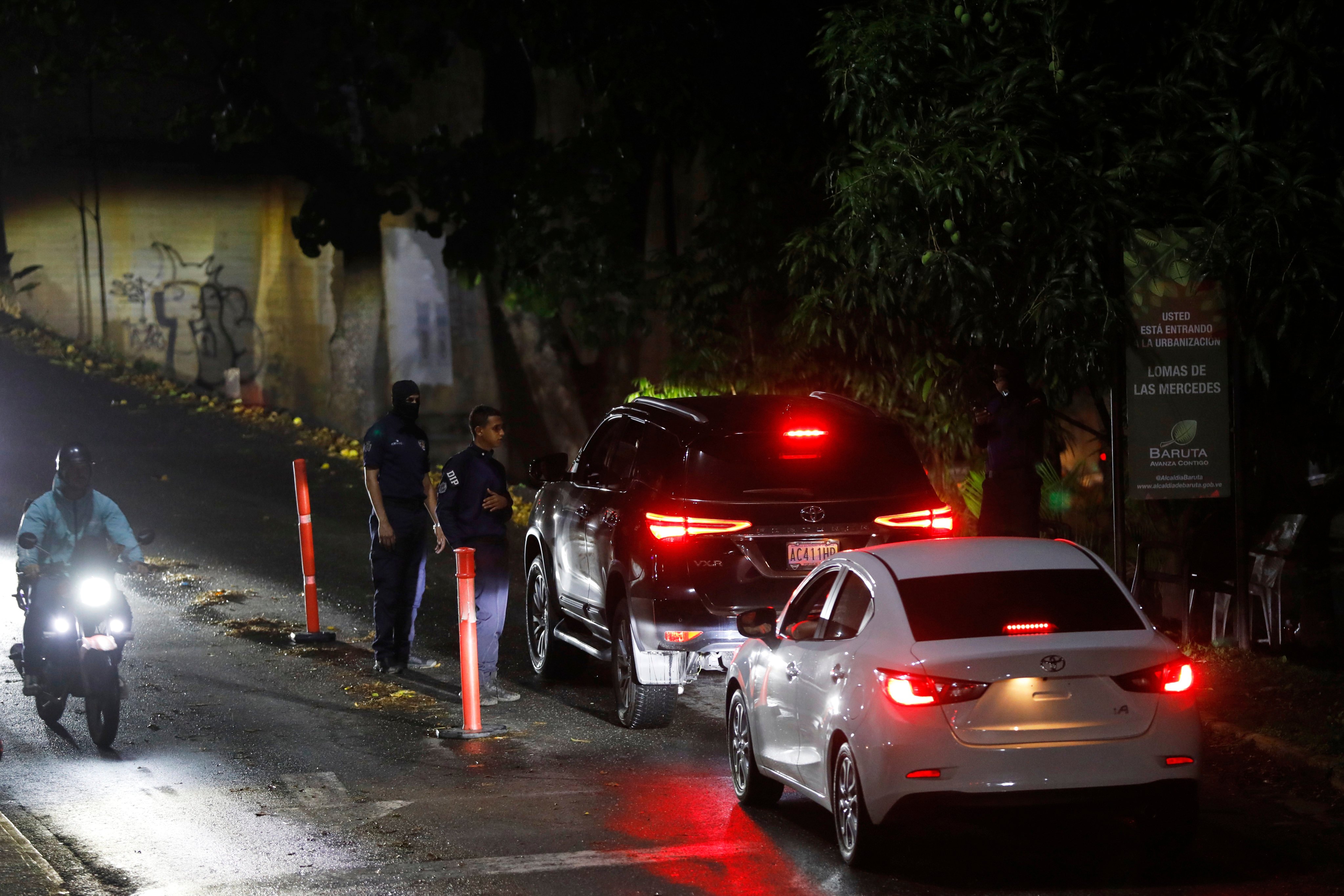 Police at a roadblock on a street leading to Argentina’s embassy in Caracas, Venezuela. Photo: AP