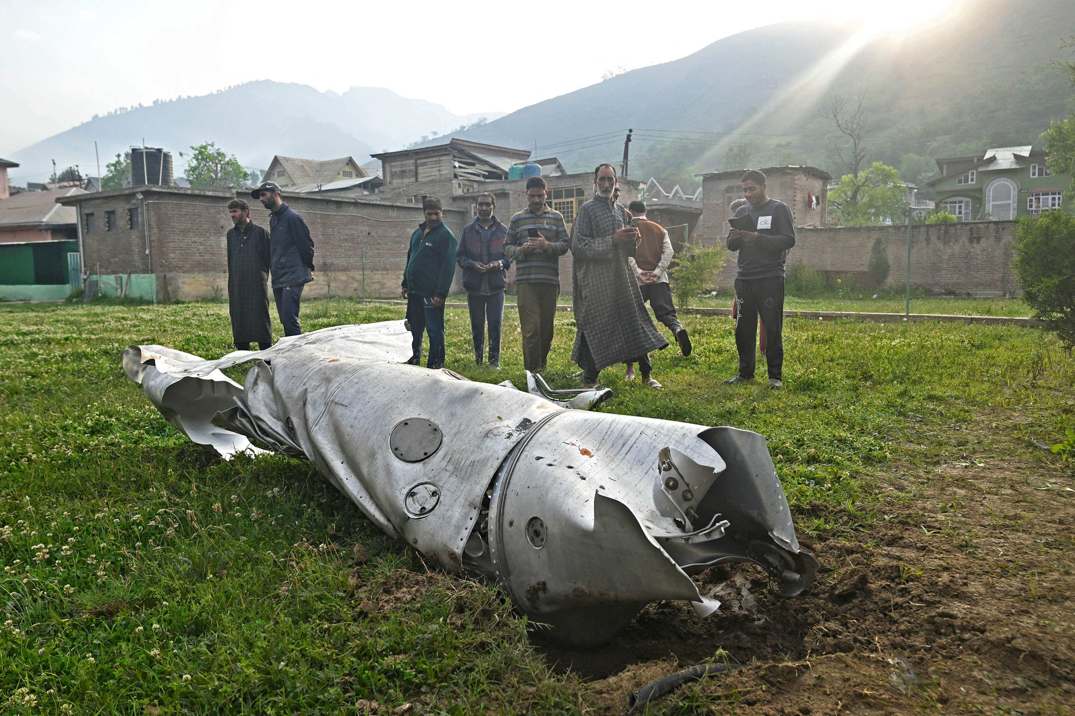 People look at a damaged part of an aircraft in Wuyan, Indian-controlled Kashmir, on Wednesday. Photo: AFP